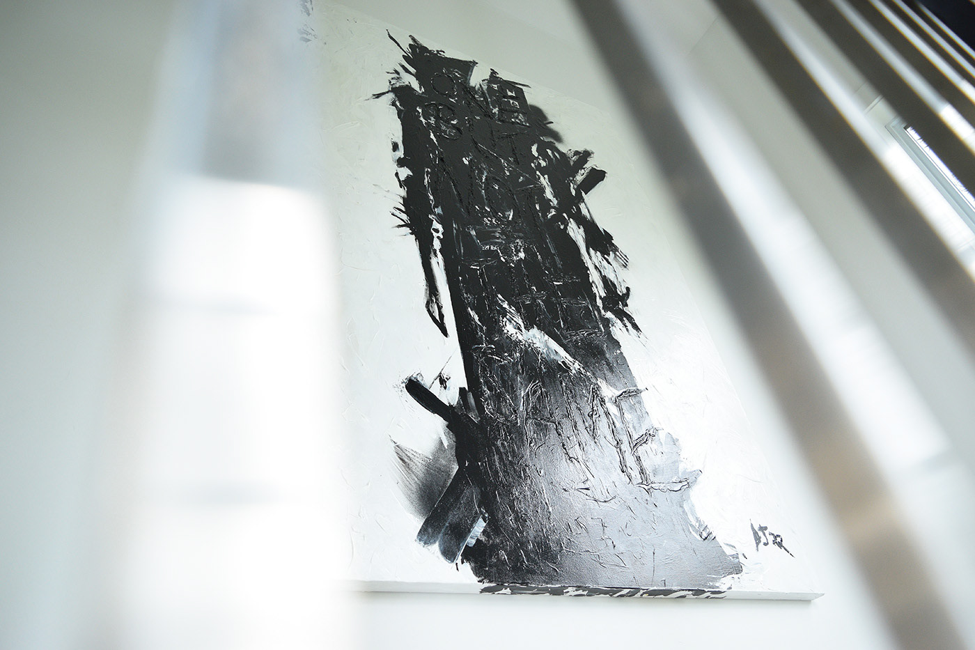 Black and white abstract painting of a human figure