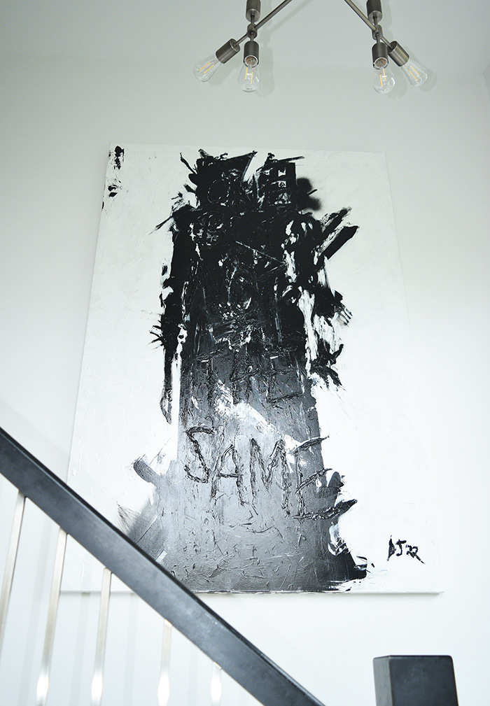 Black and white abstract painting of a human figure