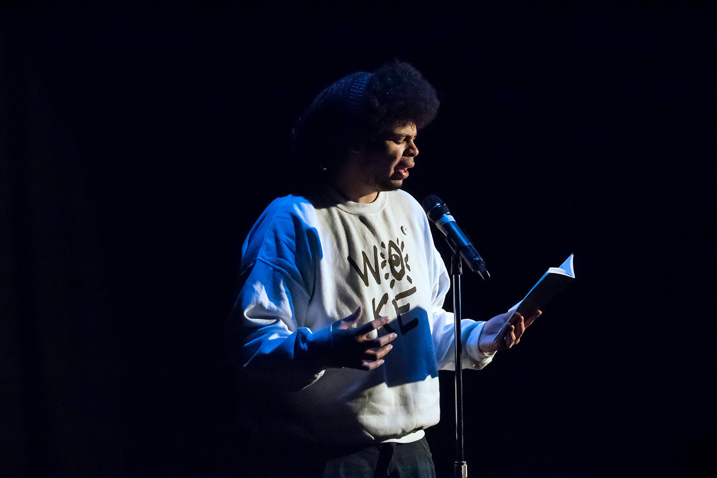 Woke sweatshirt worn by author, Andre Fenton during a performance