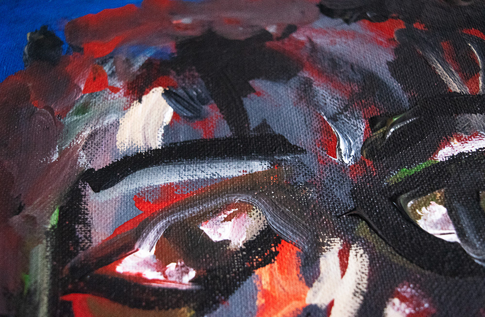 Semi-abstract painting of a face using multiple colours