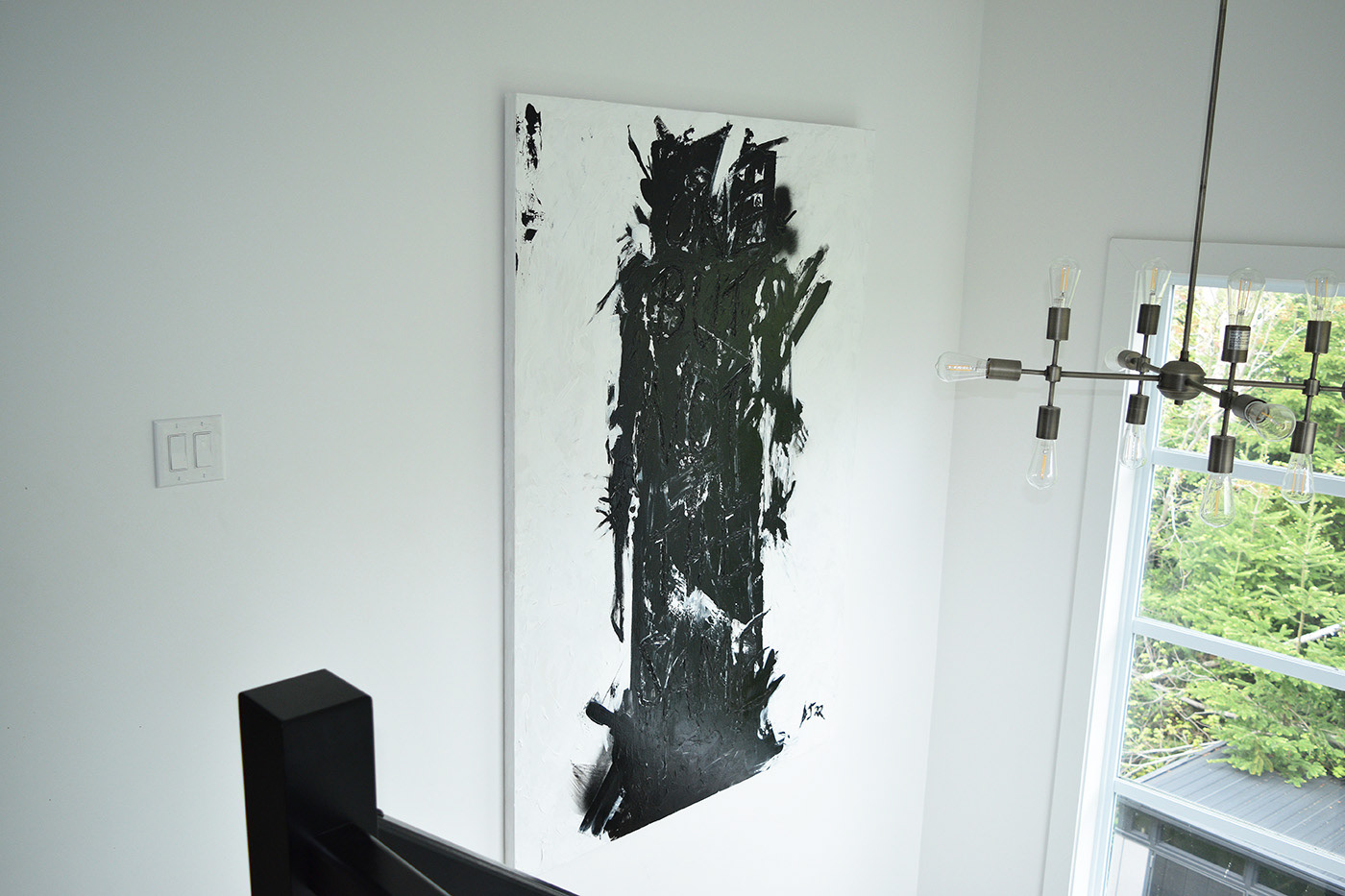 Black and white abstract painting of a human figure