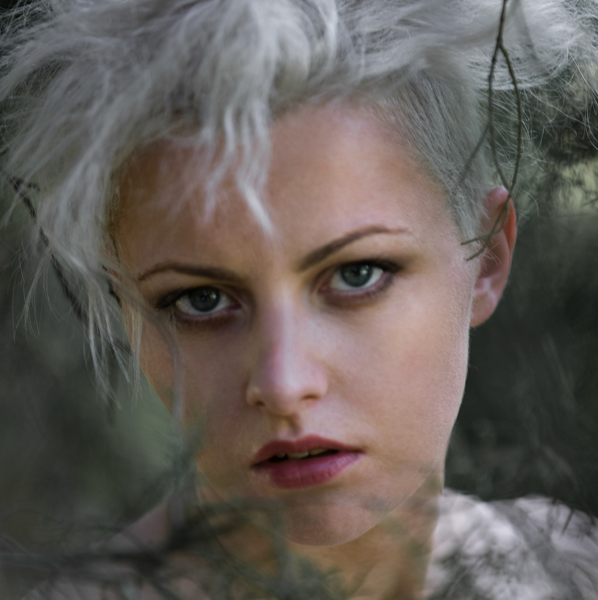 head shot, face through foliage