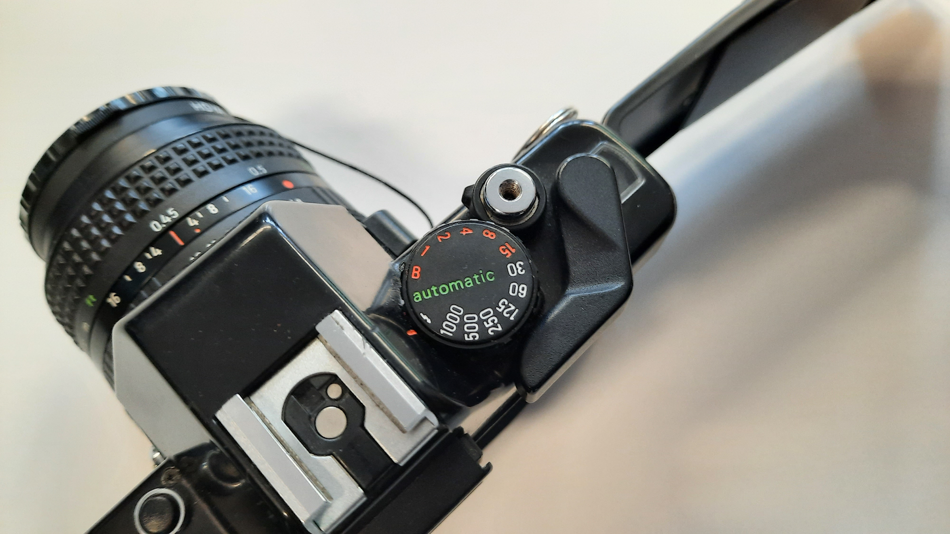 The shutter speed dial and film advance lever