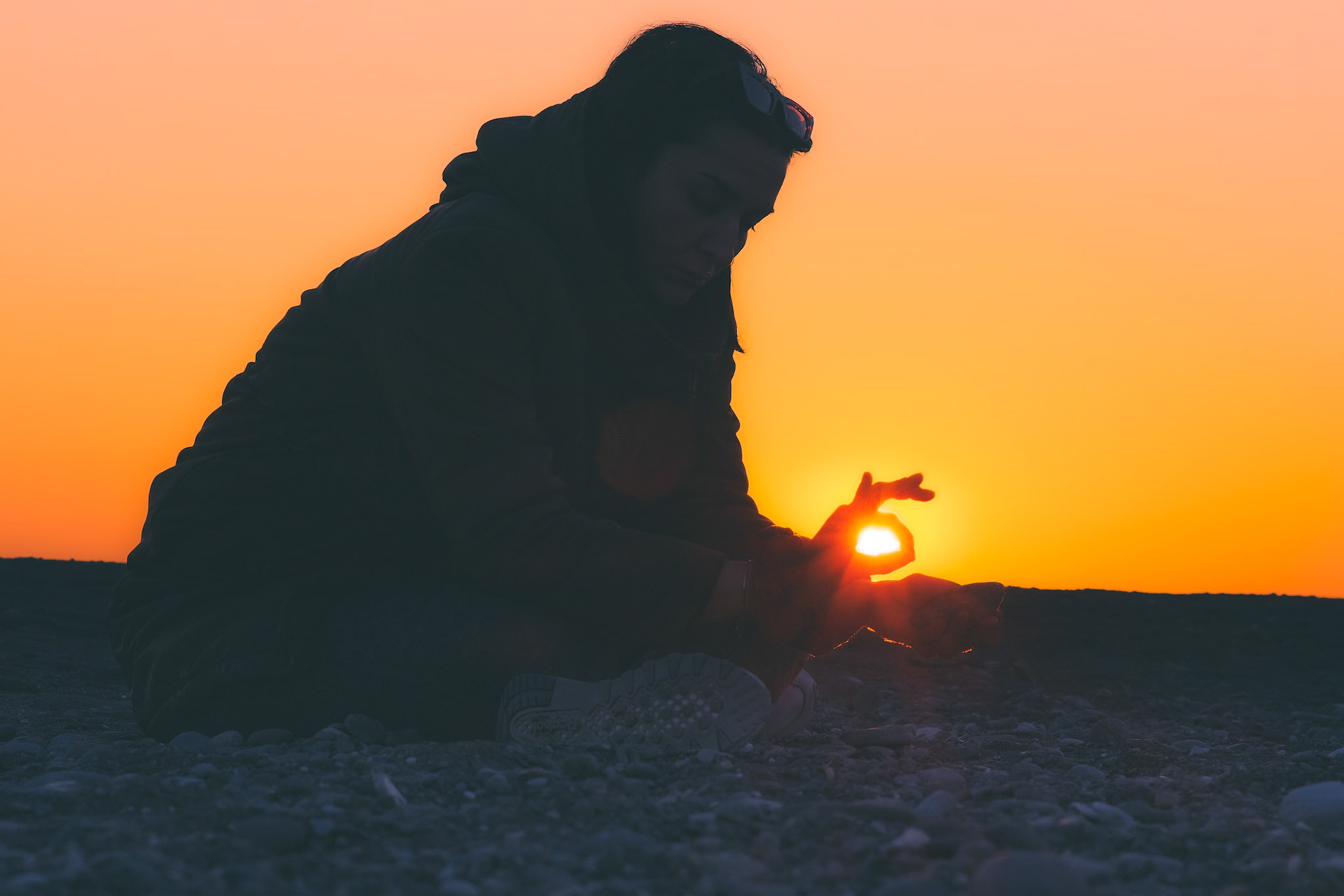 Painting on a rock with charcoal during sunset.  Taken with my Fujifilm X-T30 using the Viltrox AF 85mm f/1.8 XF II