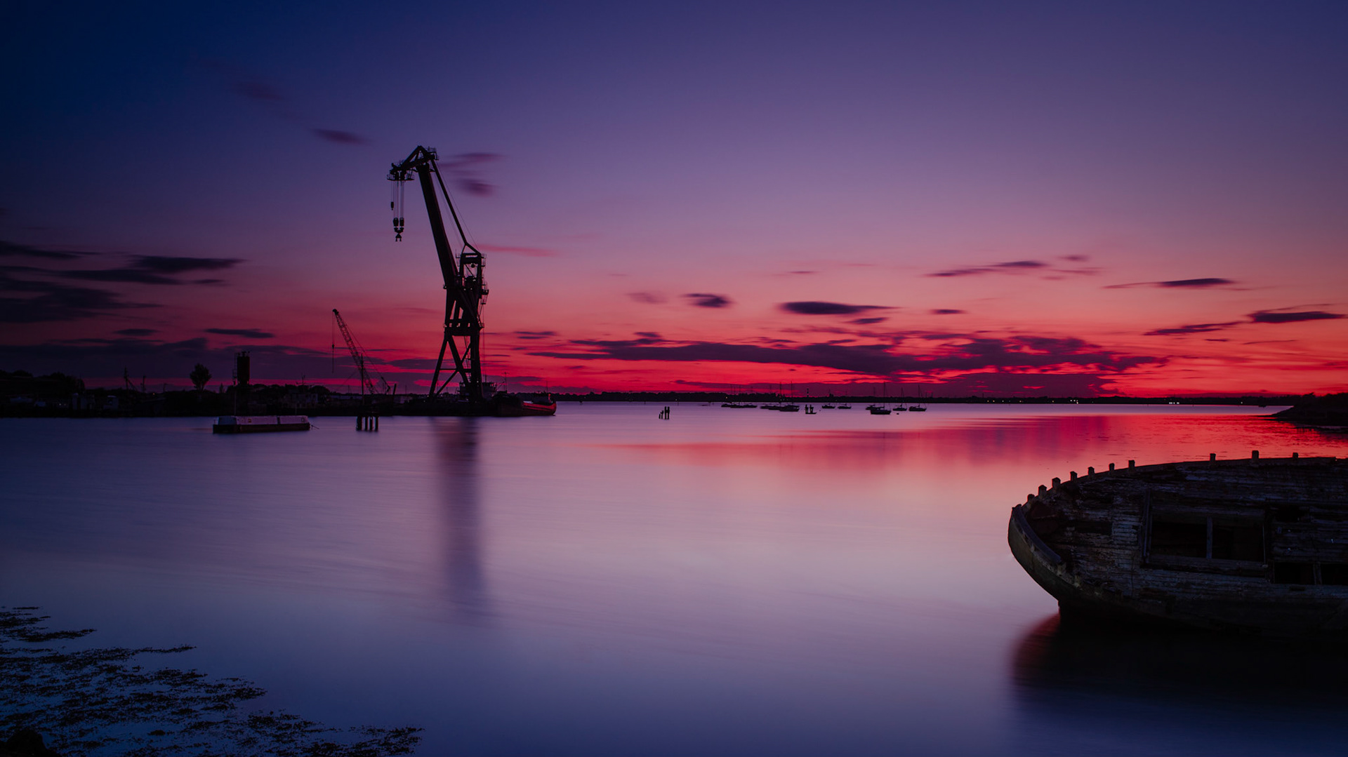 The Sun sets on the salvage crane at Portsmouth.