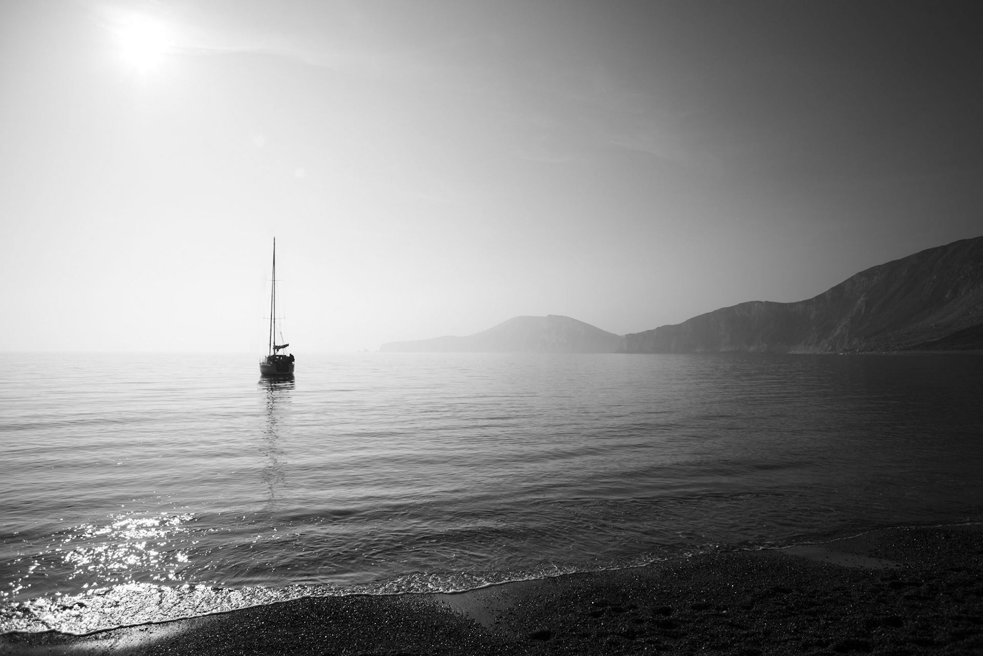At anchor in a hazy Worbarrow Bay