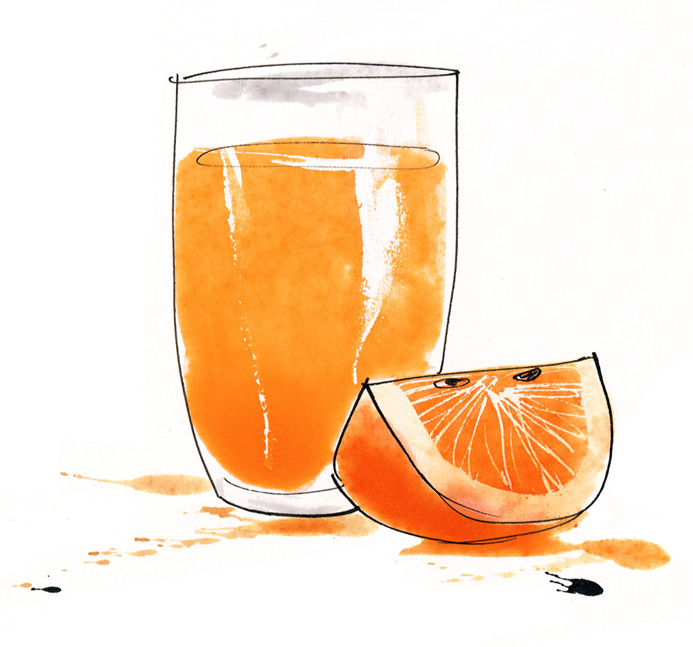 a glass of freshly squeezed orange with an orange wedge beside
