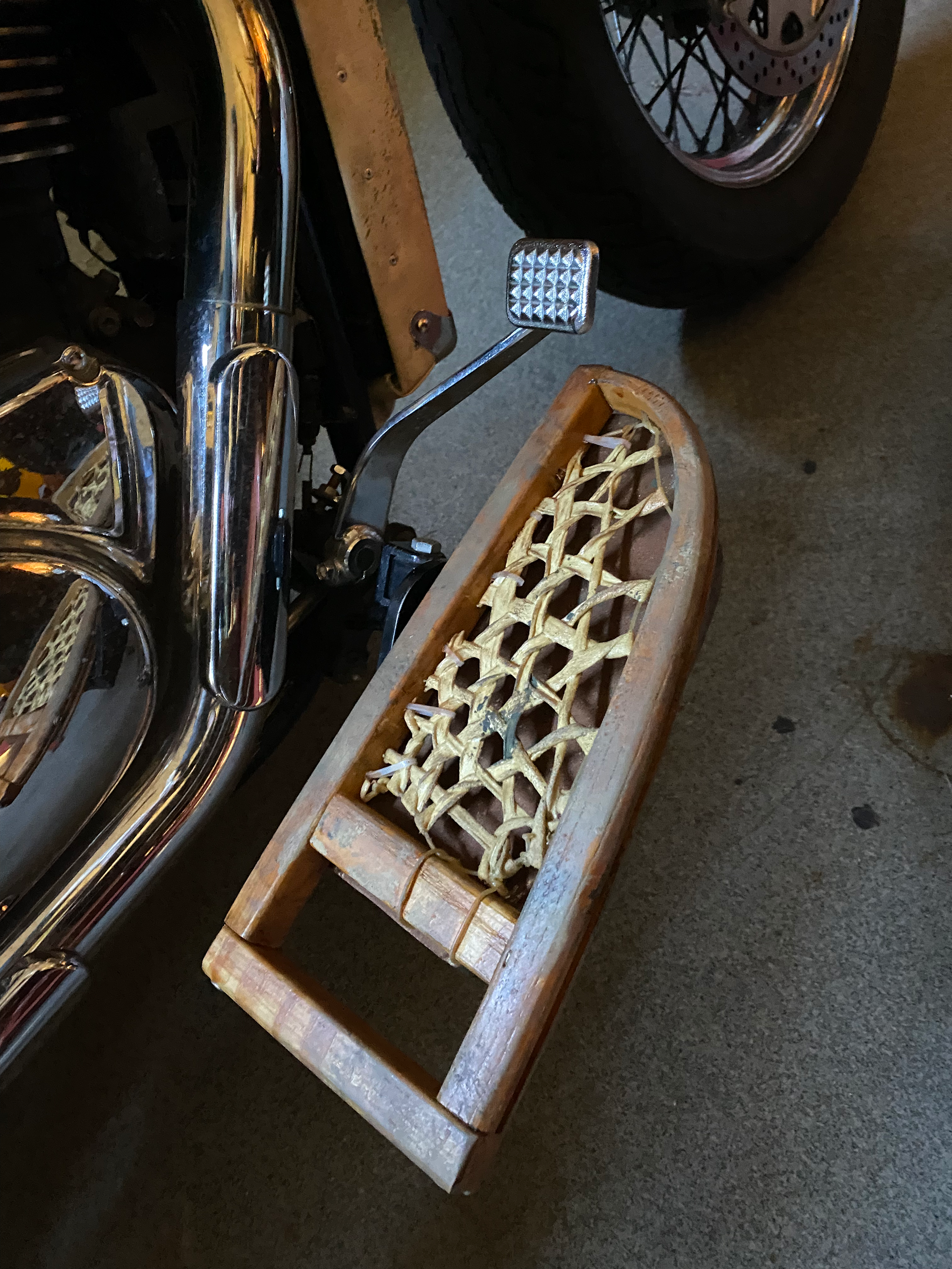 I reconfigured some old wooden snowshoes for floorboards - the reshaped metal is hidden underneath.