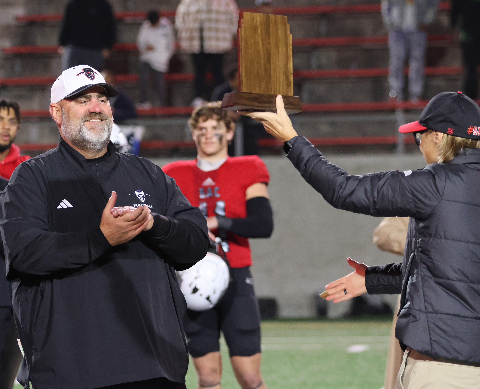Geoff Jones, Head Coach for the Santa Ana Dons, wins his first bowl game as head coach after taking over the team. He orginally was a assistant head coach but the original head coach recently passed away from cancer so Jones stepped up in his place and has been holding that same standard that was applied when he was assistant head coach.