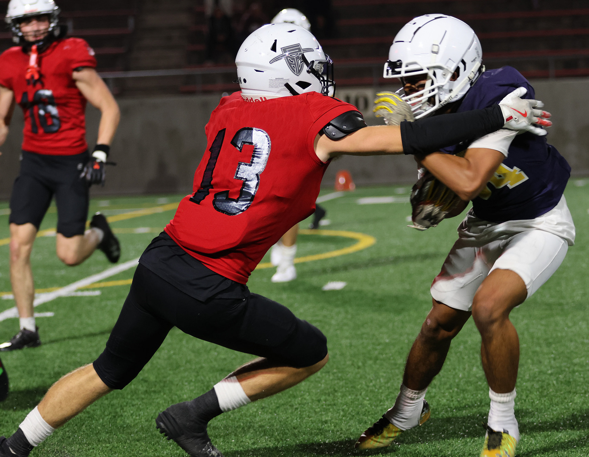 Jake Bento hustles to make an open field tackle as the running back is trying to get outside and run down the sidlene. 