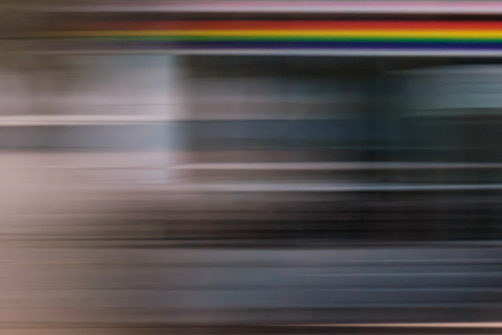 Digital Isolation VIII — blurred grey, beige and black bands beneath a thin rainbow line.