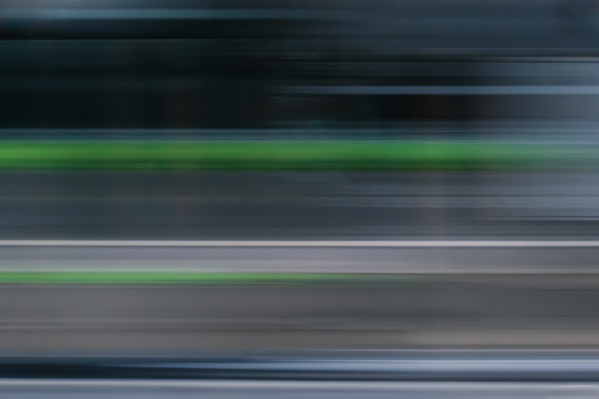 Digital Isolation IX — dark grey and teal motion blur crossed by a lime-green band.