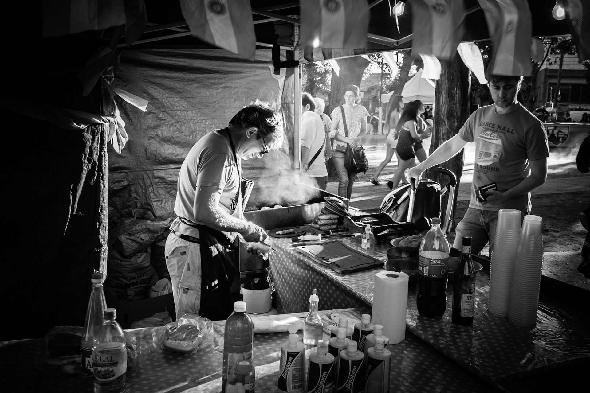 A vendor sells street food at fair in a neighborhood on the outskirts of Buenos Aires.