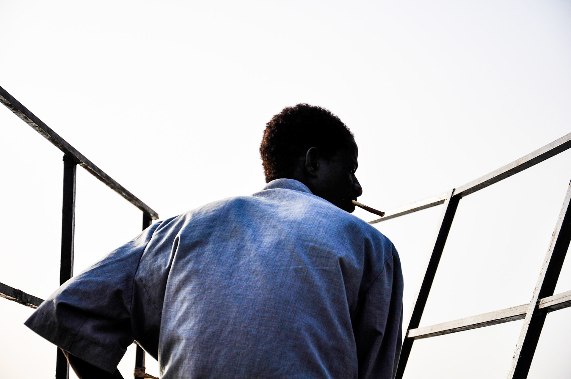 Niamey, Niger. A boat captain cruises the Niger River. Taken February 16, 2011.
