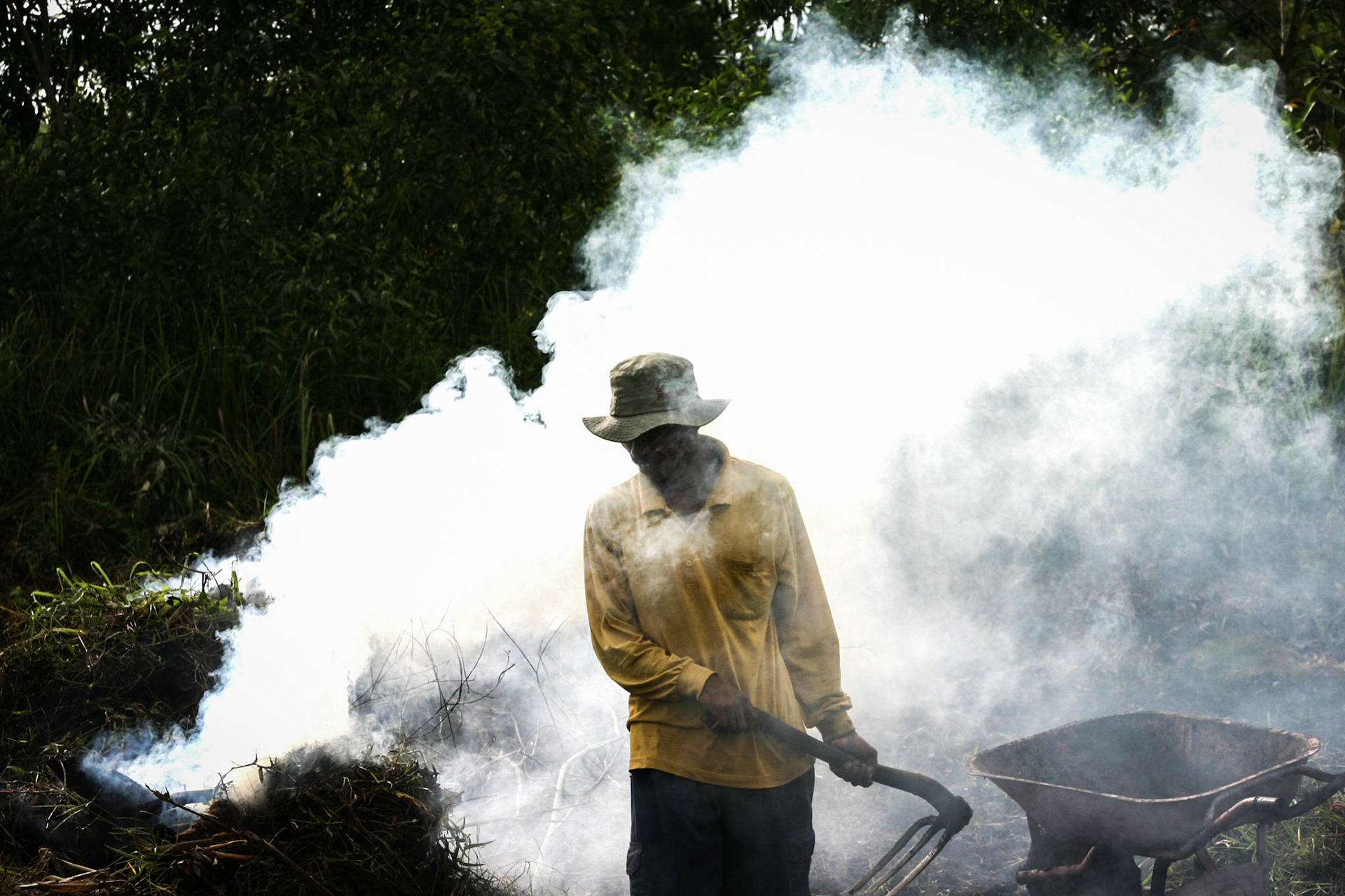 A farmer in Central Kalimantan, Indonesia, clears land by burning so that he can plant rice and other crops. Taken August 31, 2008.
