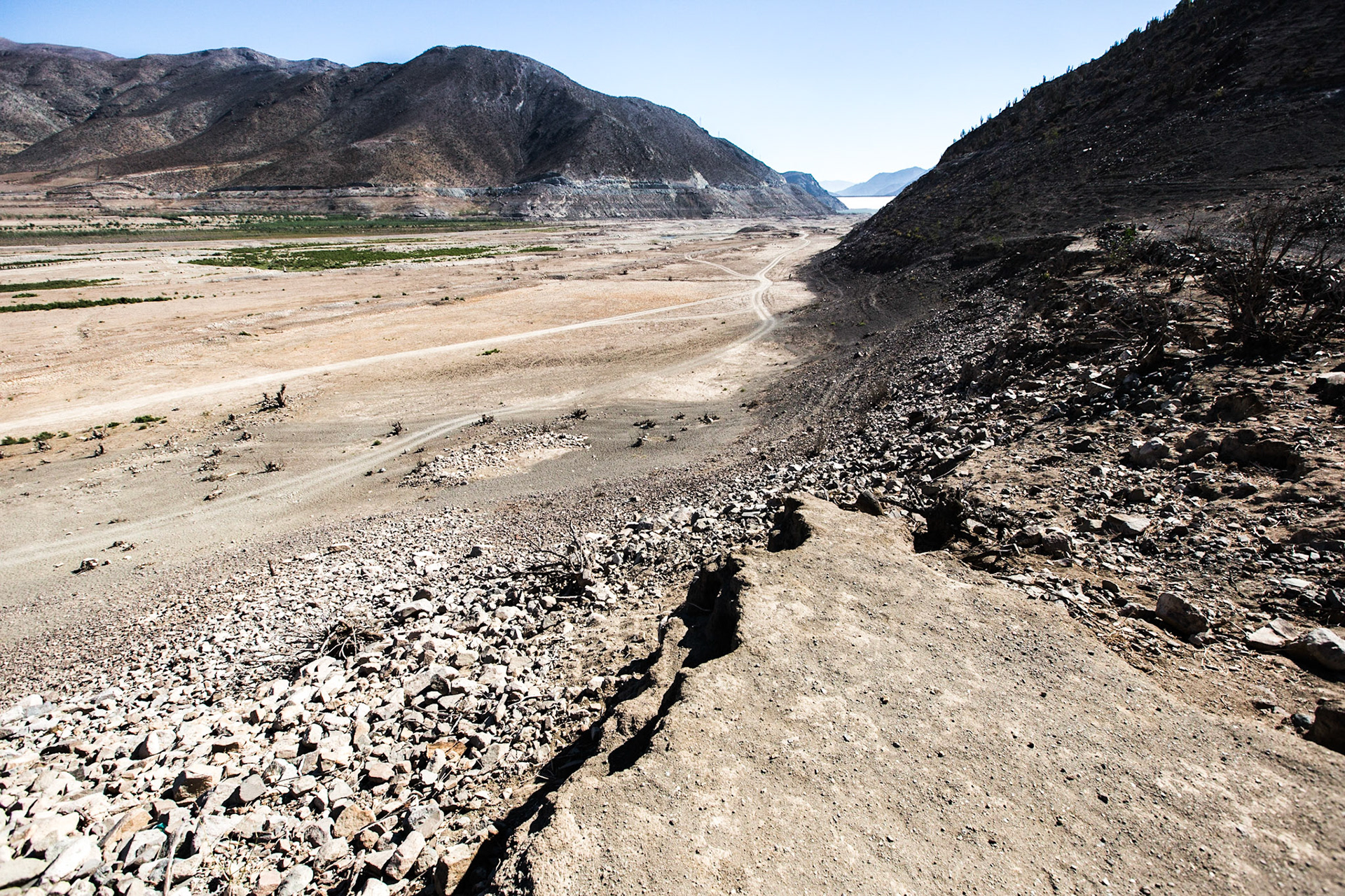 Gualliguaica, Chile. The Puclaro Reservoir is at around 10% of it's peak in 2009, indicated by lines on the mountain in the background. The dam is in the distance. Without the reservoir, farmers, mines and other water users have lost one of their key buffers against drought. Taken April 29, 2013.