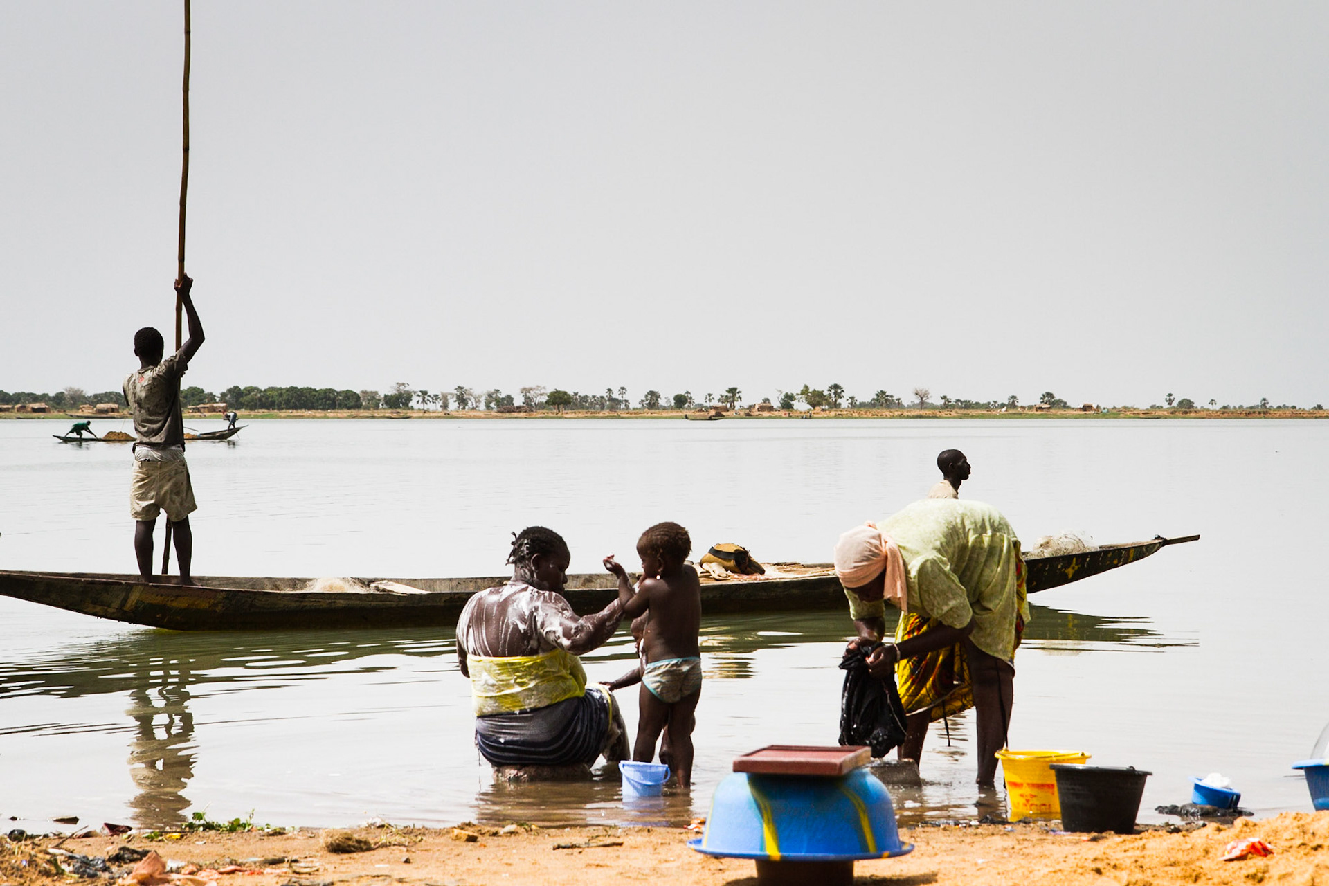 Segou, Mali. The Niger River is central to life in Segou. Women wash clothes, while men use boats to fish and collect vegetation. Taken June 30, 2012.