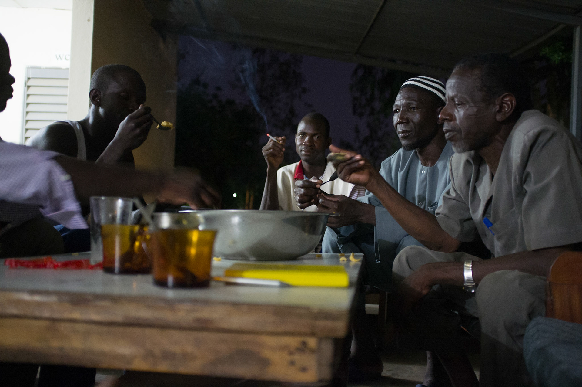 Djouna, Mali. Workers from Burkina Faso rest after a day of building greenhouses at a research station. Taken June 30, 2012.