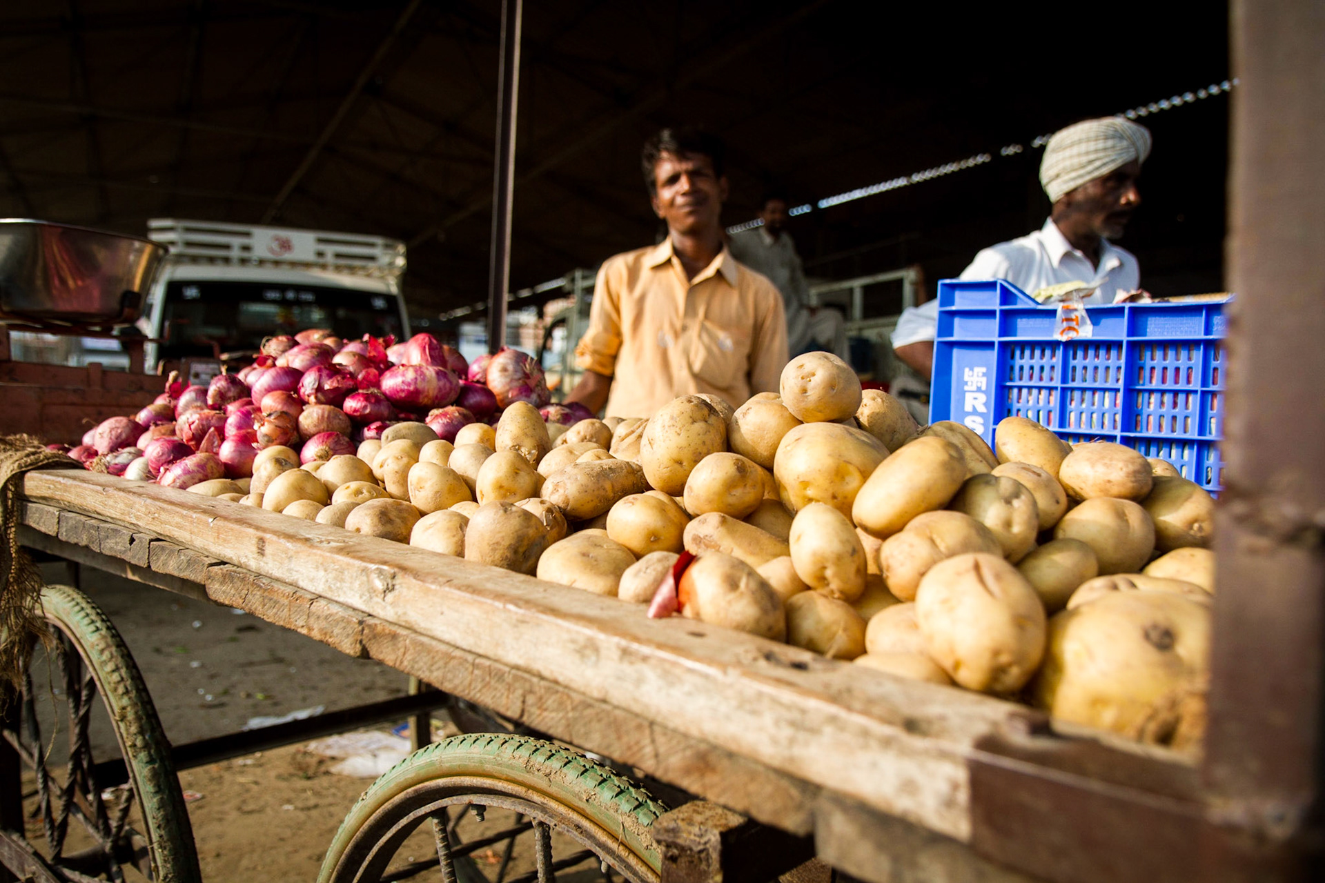 Goniana, Punjab, India.  A man sells potatoes and onions loaded on a cart. Taken September 1, 2012.