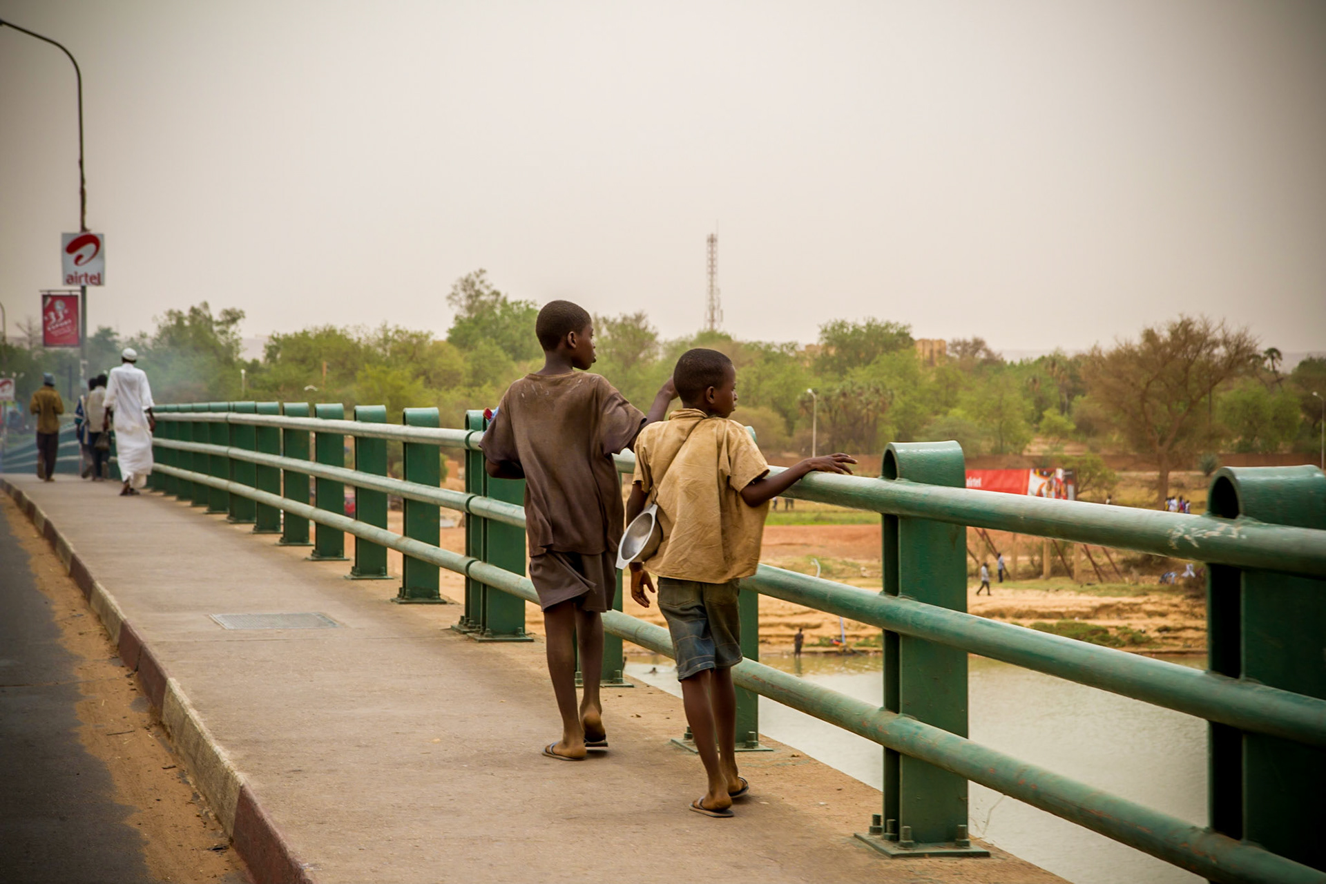 Niamey, Niger. Two boys cross the Niger River on a bridge. Taken May 9, 2012.