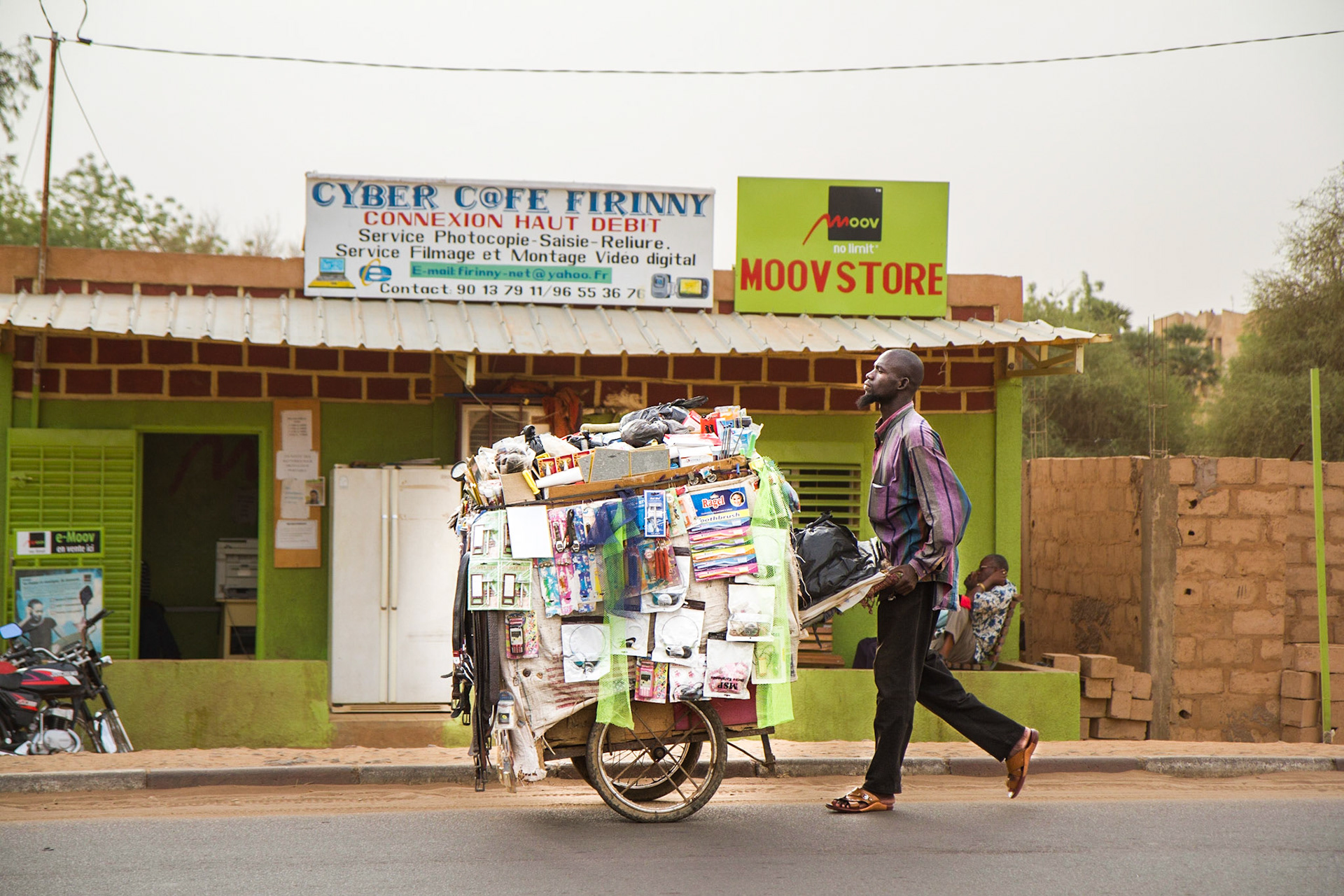 Niamey, Niger. A man pushes a vendor cart down a street in Niamey. Taken May 9, 2012.