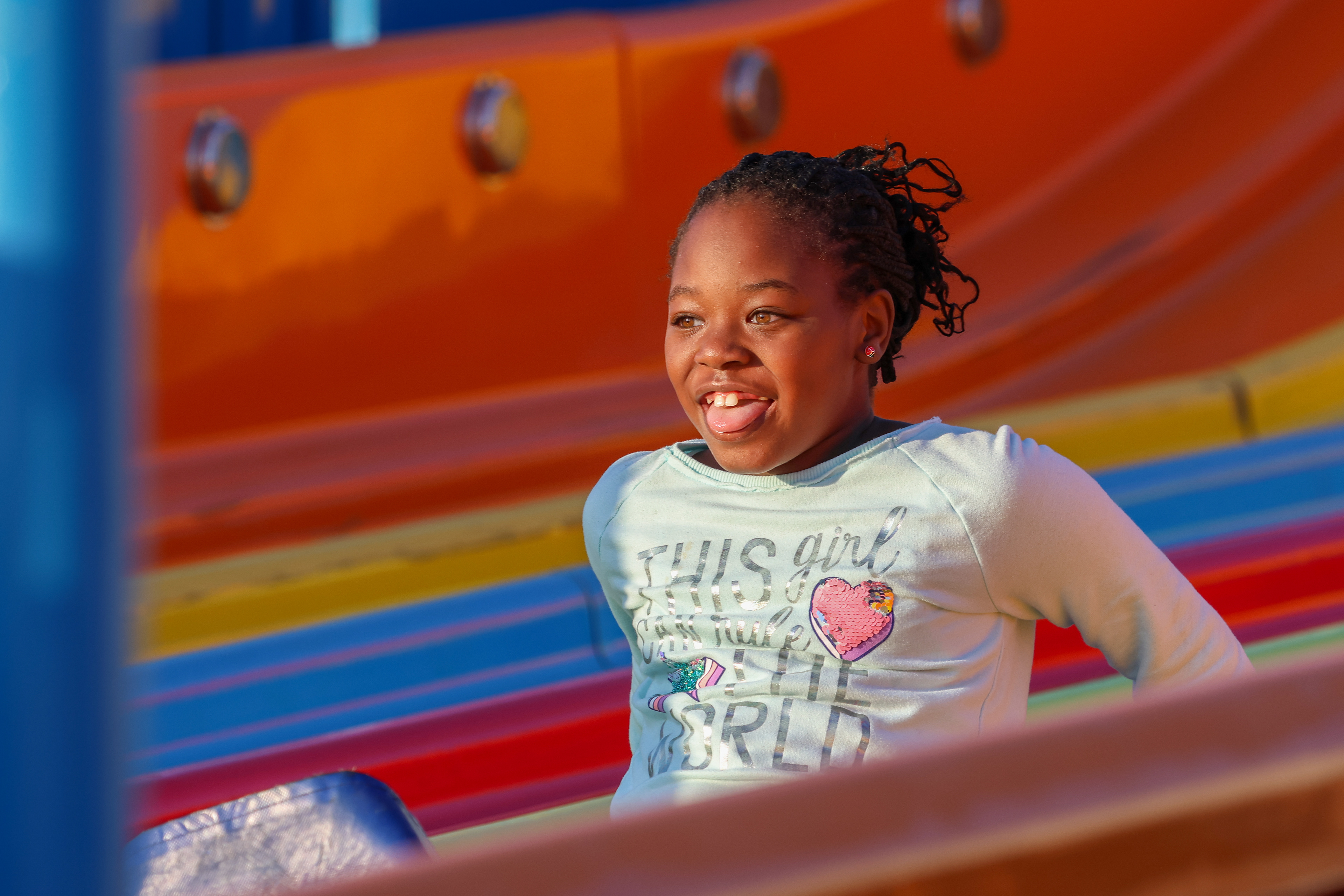 Jinora Cullins, 9, from Fort Valley, Georgia comes down the slide at the Georgia National Fair in Perry, Georgia on Saturday, Oct. 14, 2023. (Photo/ Samantha Hurley) 404 432 5747 