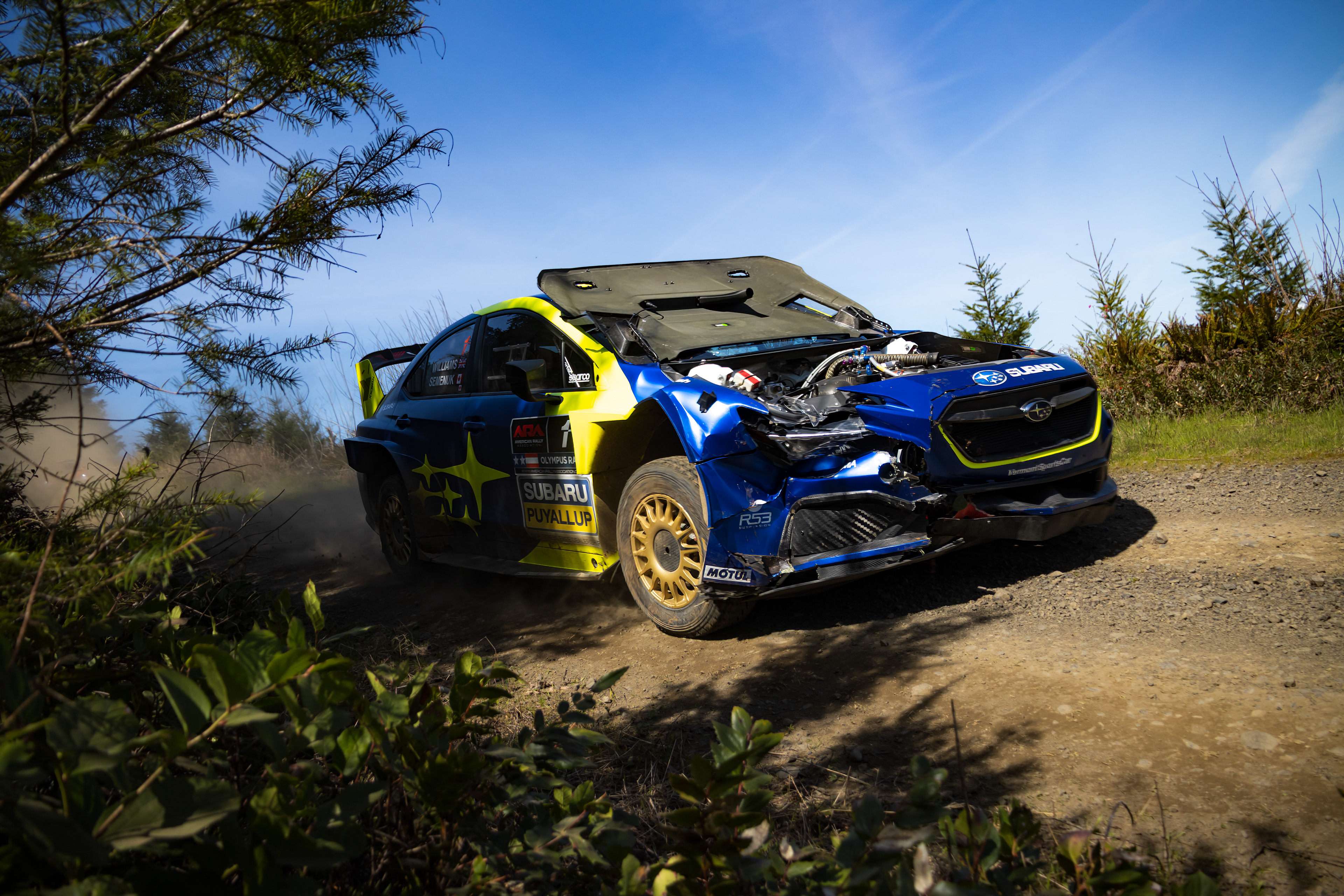 Car #1 with hood damage