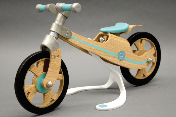 Furcula: Scale model of children's balance bike, designed and built by me. Styrene, wood, wood veneer.