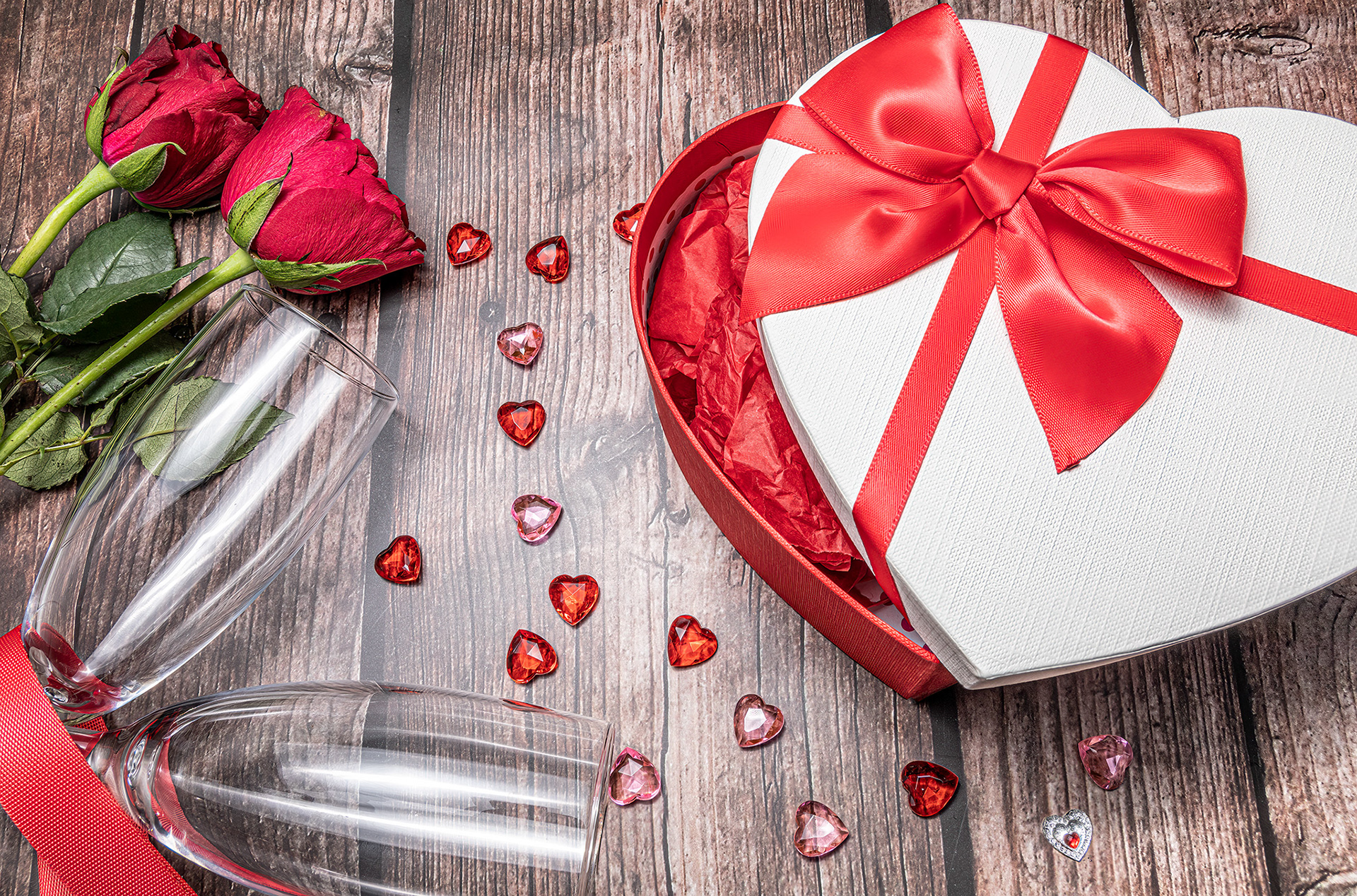heart shaped gift box and champagne flutes