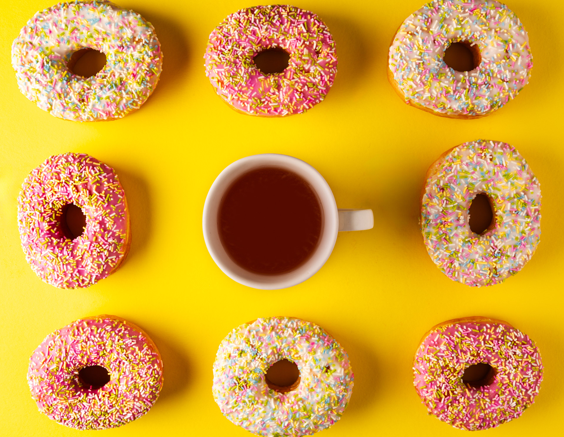 A flat lay of assorted glazed doughnuts
