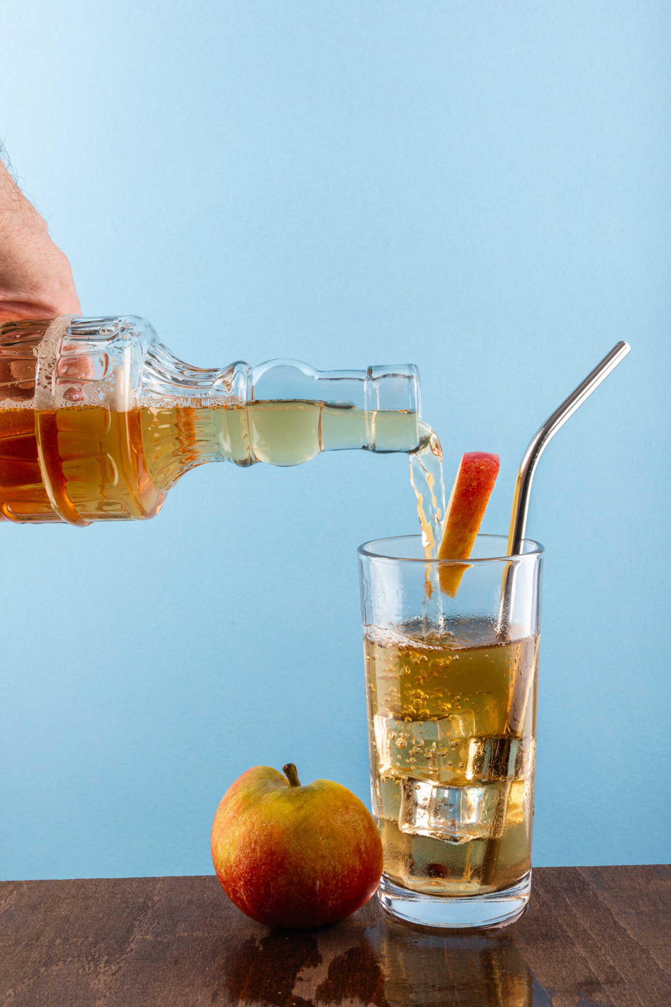 pouring apple juice into a glass