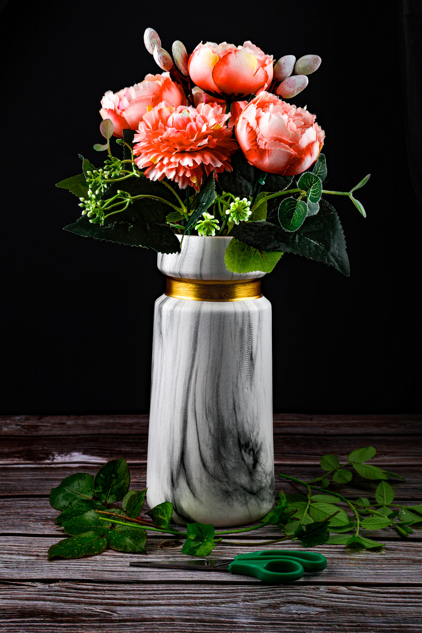 mixes flowers in a vase