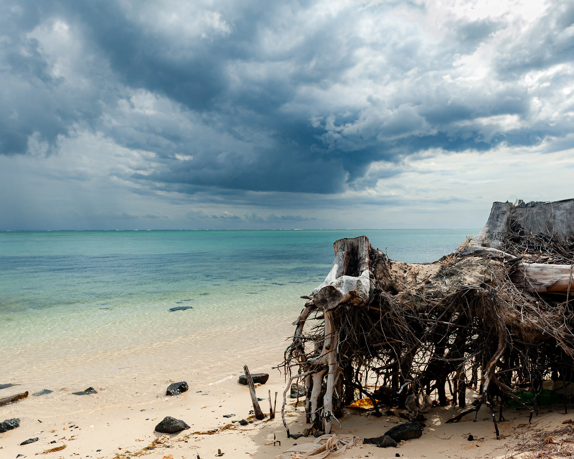Coastal erosion is the "natural" wearing away and loss of land, sediment, and rock along shorelines, driven by powerful forces like waves, tides, wind, and currents, often intensified by storms and rising sea levels, which reshapes coasts and threatens infrastructure.