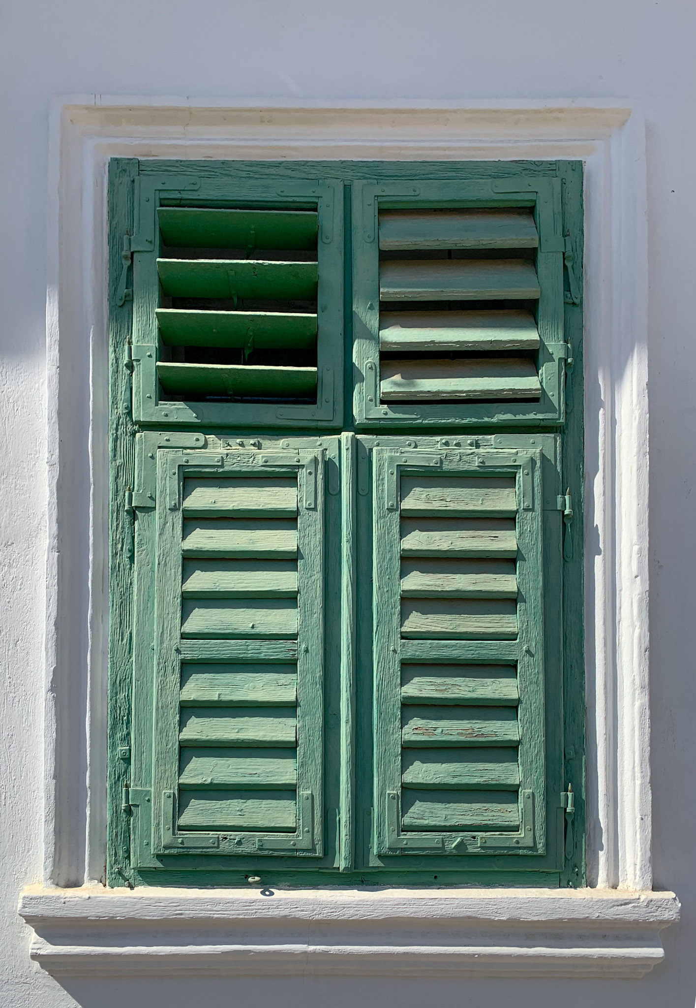 Window shutters on houses in Rimetea