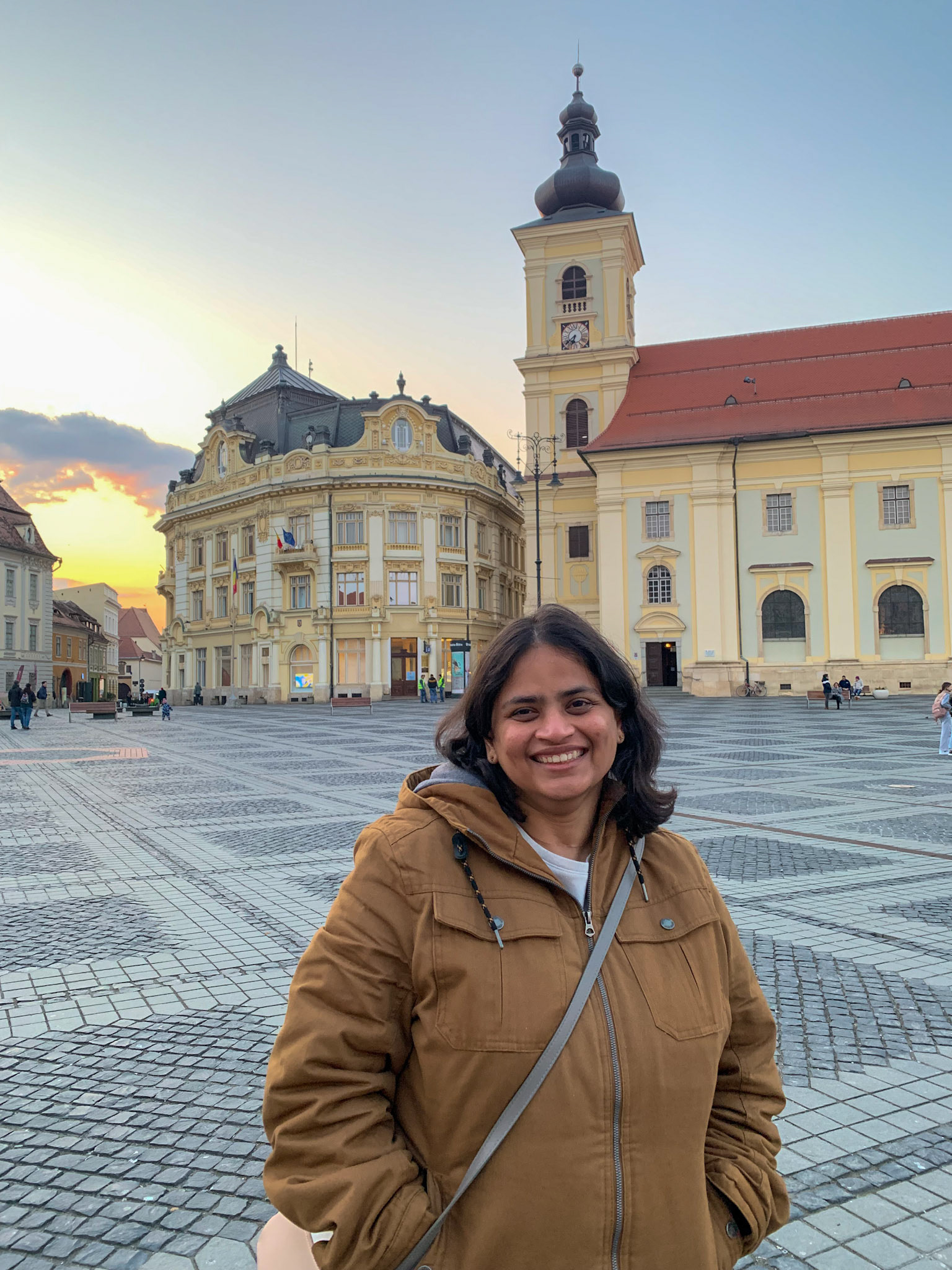 The Sibiu City Hall and Holy Trinity Roman Catholic Church are seen in the background
