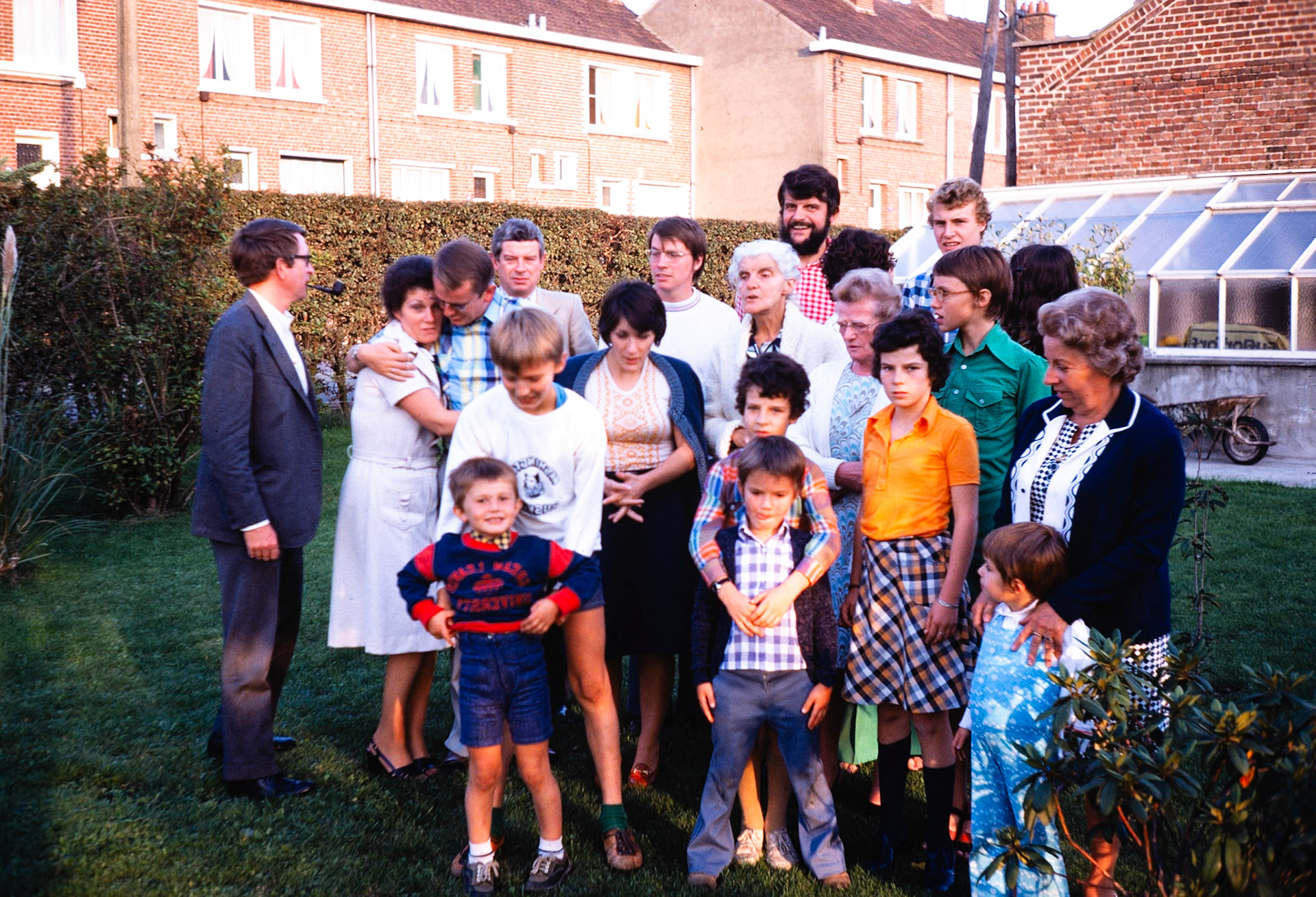 Gathering for a multi-generational family photo in France.