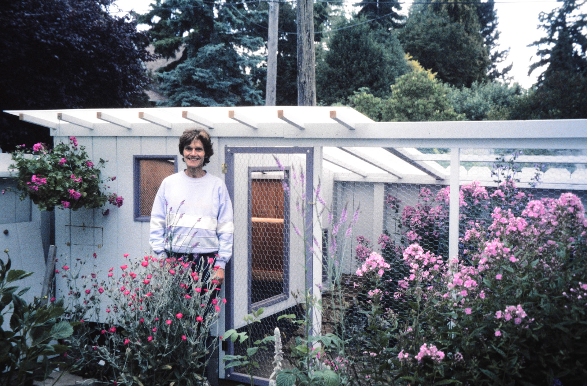 Beside her Ballard chicken coop.