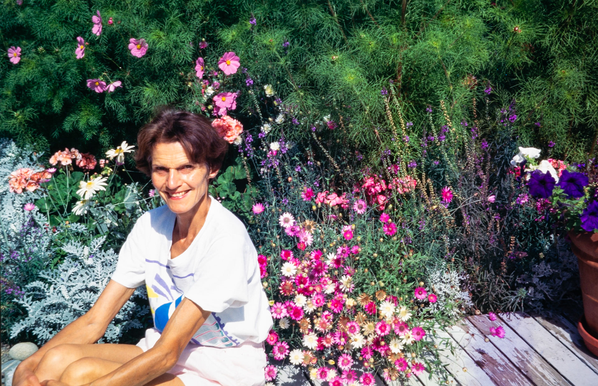 Enjoying a moment among the flowers on her Ballard patio.