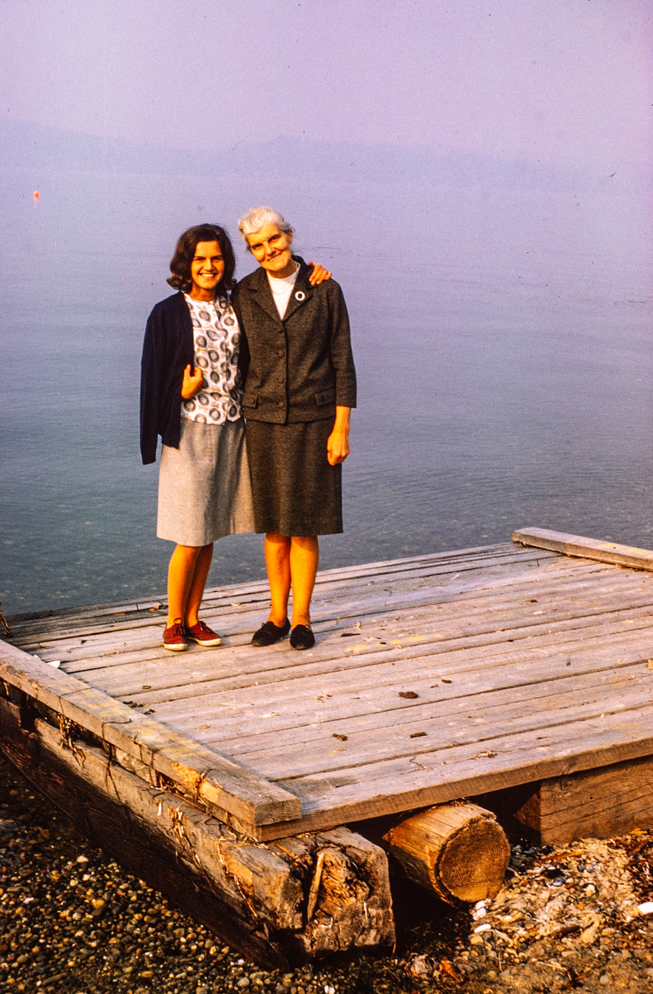 Standing with her mother on the dock at Seabeck low tide.