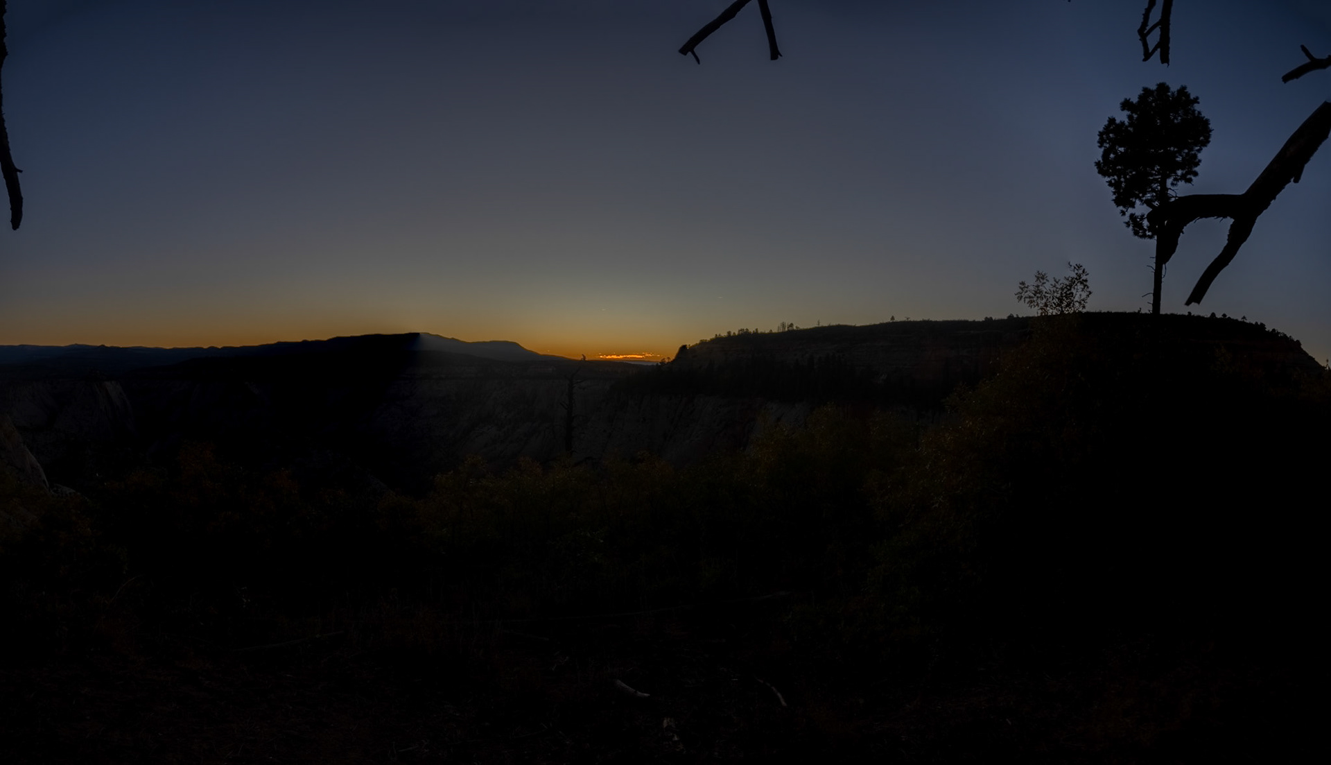 The early glow of sunrise on a cloudless morn