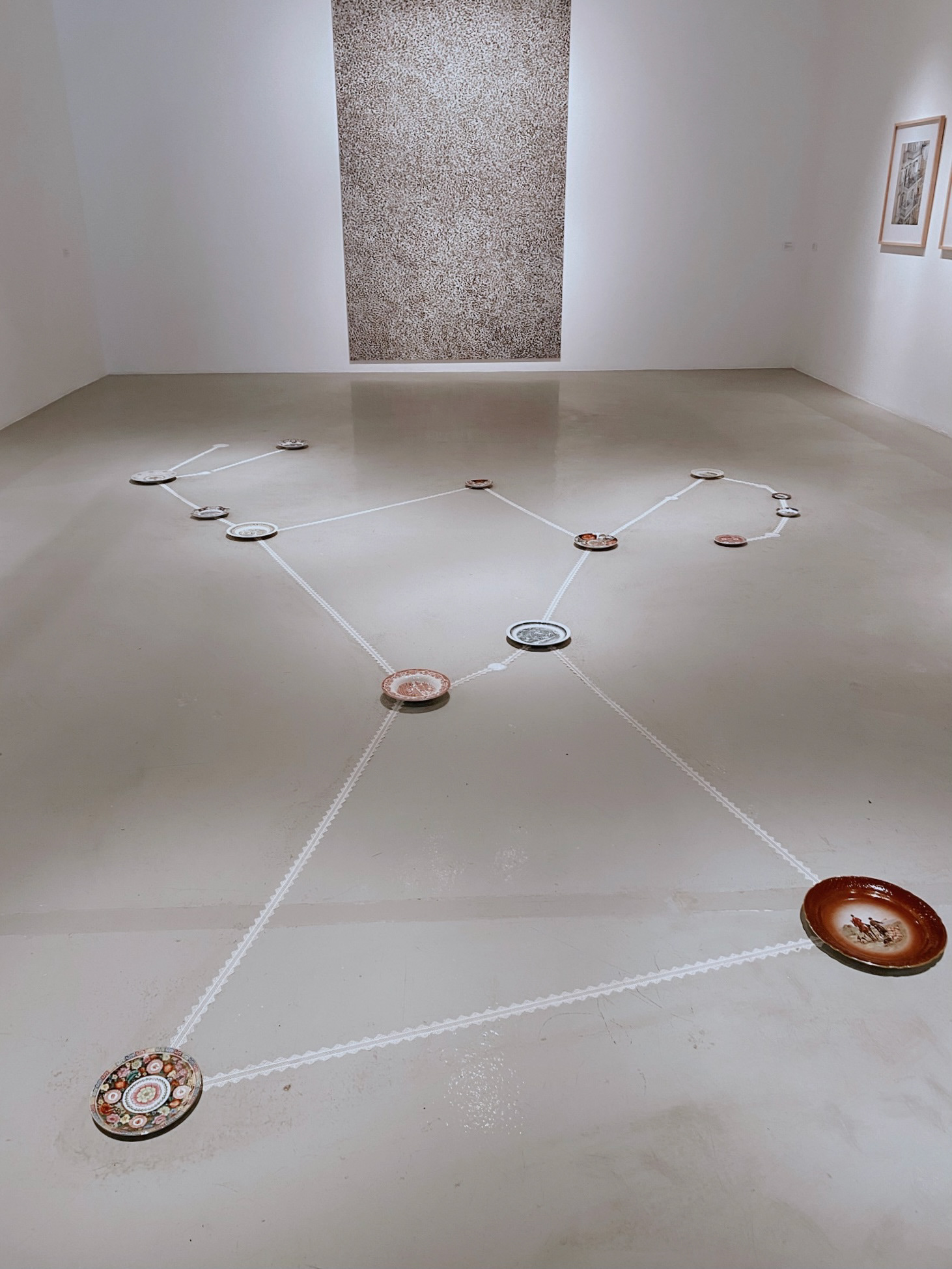 Leyla's Hunt, installation, antique plates, laces, chalk, 2021