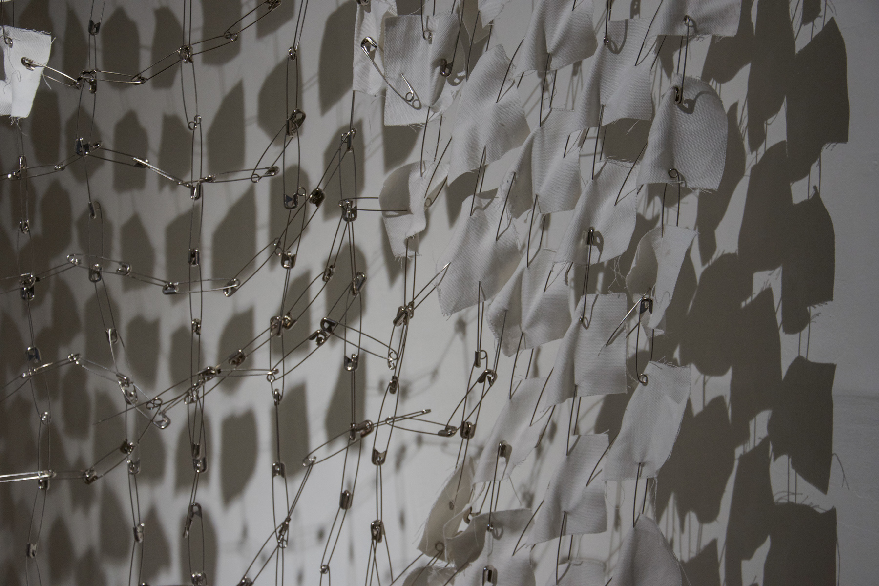 Puzzle, 2022, installation, fabric, safety pins, 250 x 300 cm / installation view from Occupation, Barın Han, 2022