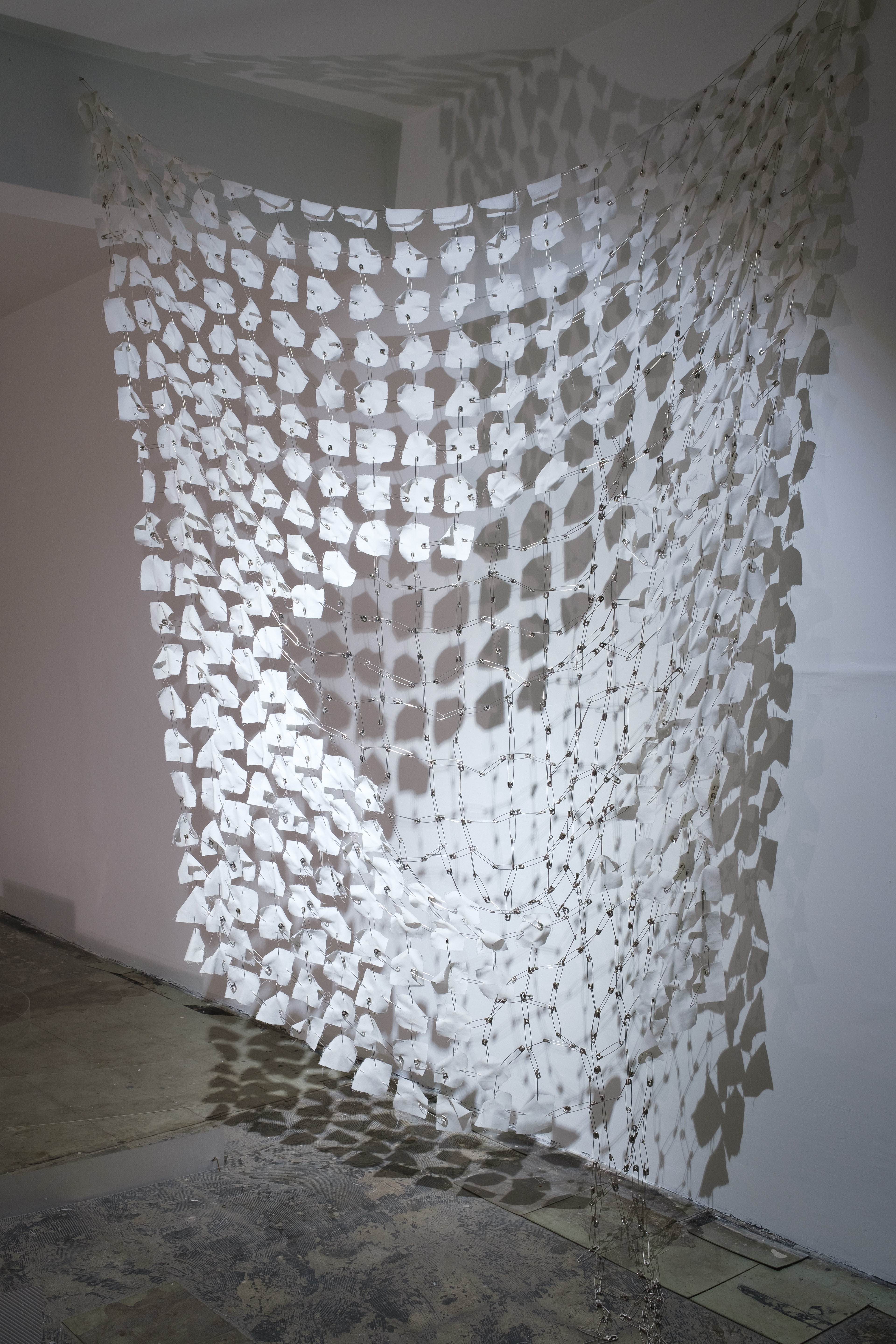 Puzzle, 2022, installation, fabric, safety pins, 250 x 300 cm / installation view from Occupation, Barın Han, 2022