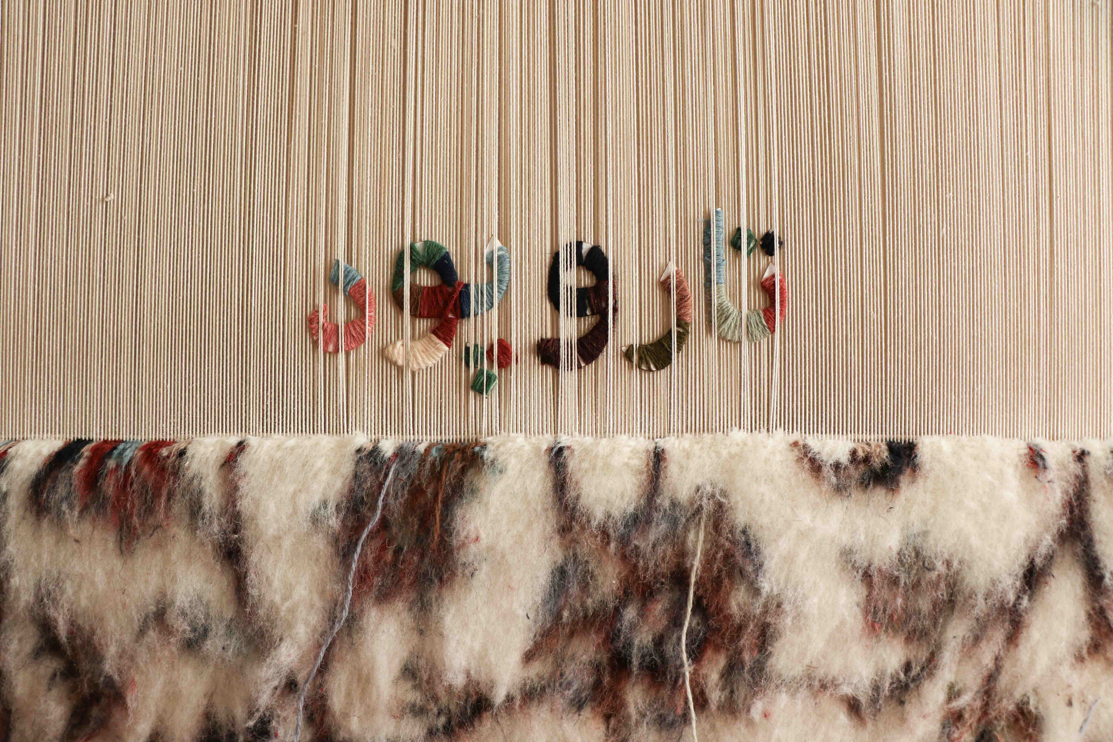 Strings wrapped around the words cutouts