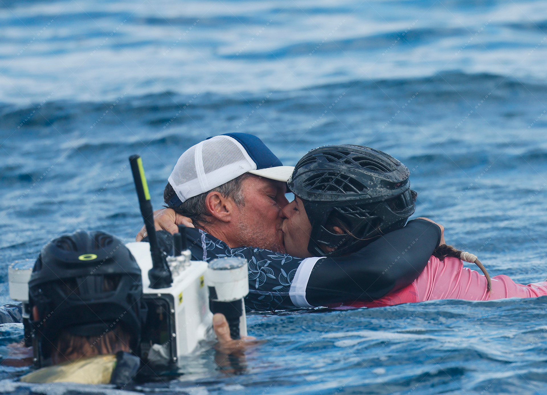 Johanne Defay kisses her husband and coach Simon Paillard, after women's bronze medal match, Aug. 5, 2024