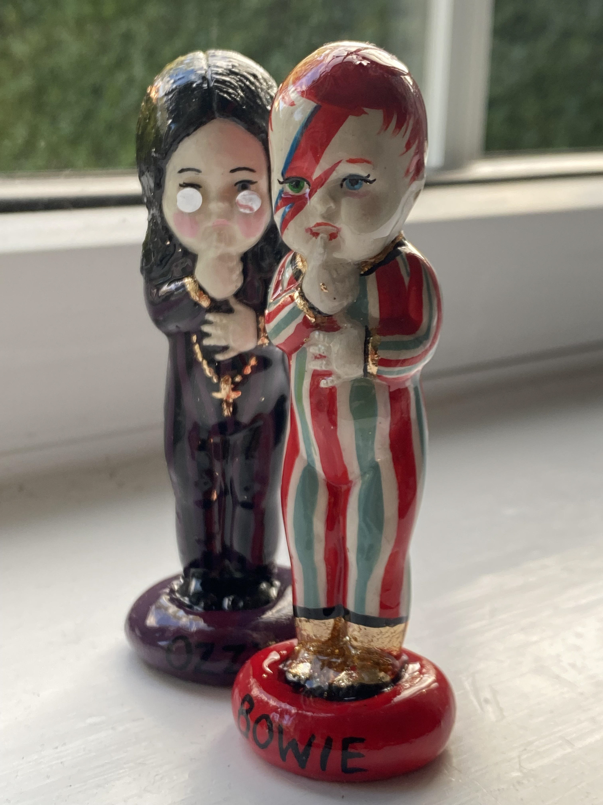 Baby Ozzy and Baby Bowie (cast from vintage baby doll toy) by Helen Brown