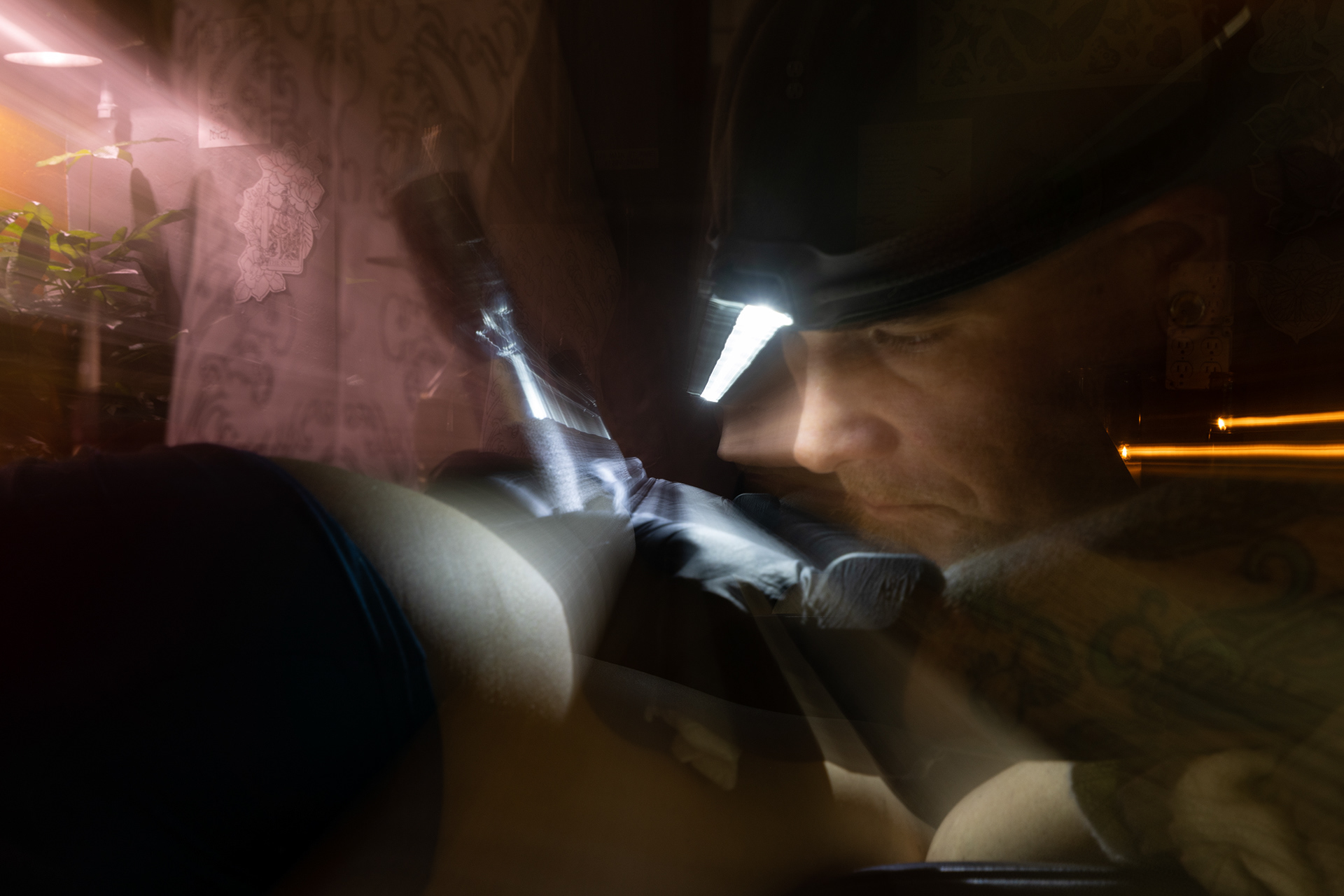 Lucky D., a Springfield tattoo artist, performs a meditation-breathwork tattoo session with Cedar Ward, his client, on Oct. 29, 2023. | 3.2s f/10.0 ISO100