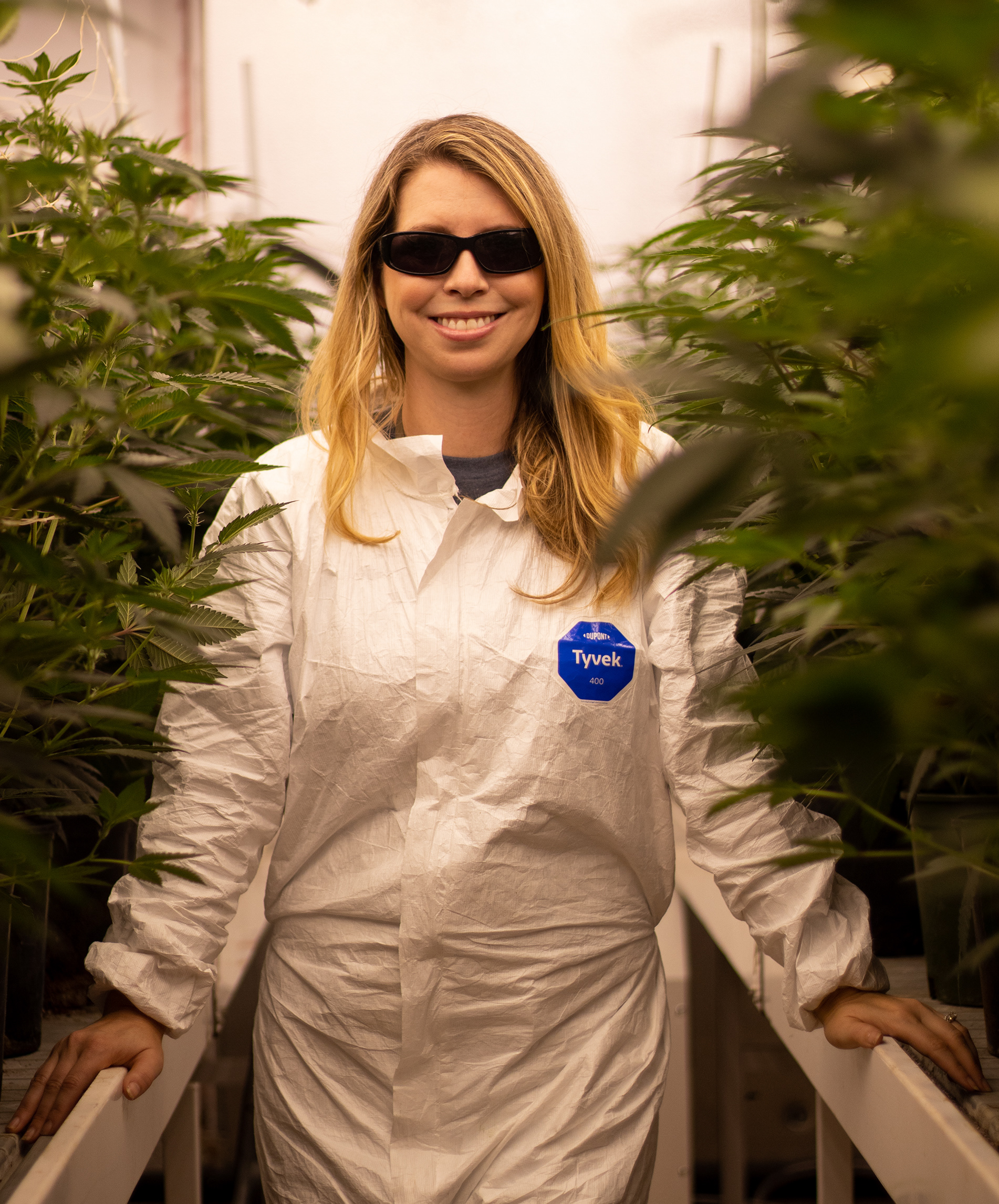Holly Hillyer poses for a portrait inside of the indoor growing space at Utokia Farm, which she operates alongside her husband Adam Teuscher, on Oct. 13, 2023. (Shot for Emerald Media Group) | 1/3200 f/1.8 ISO200