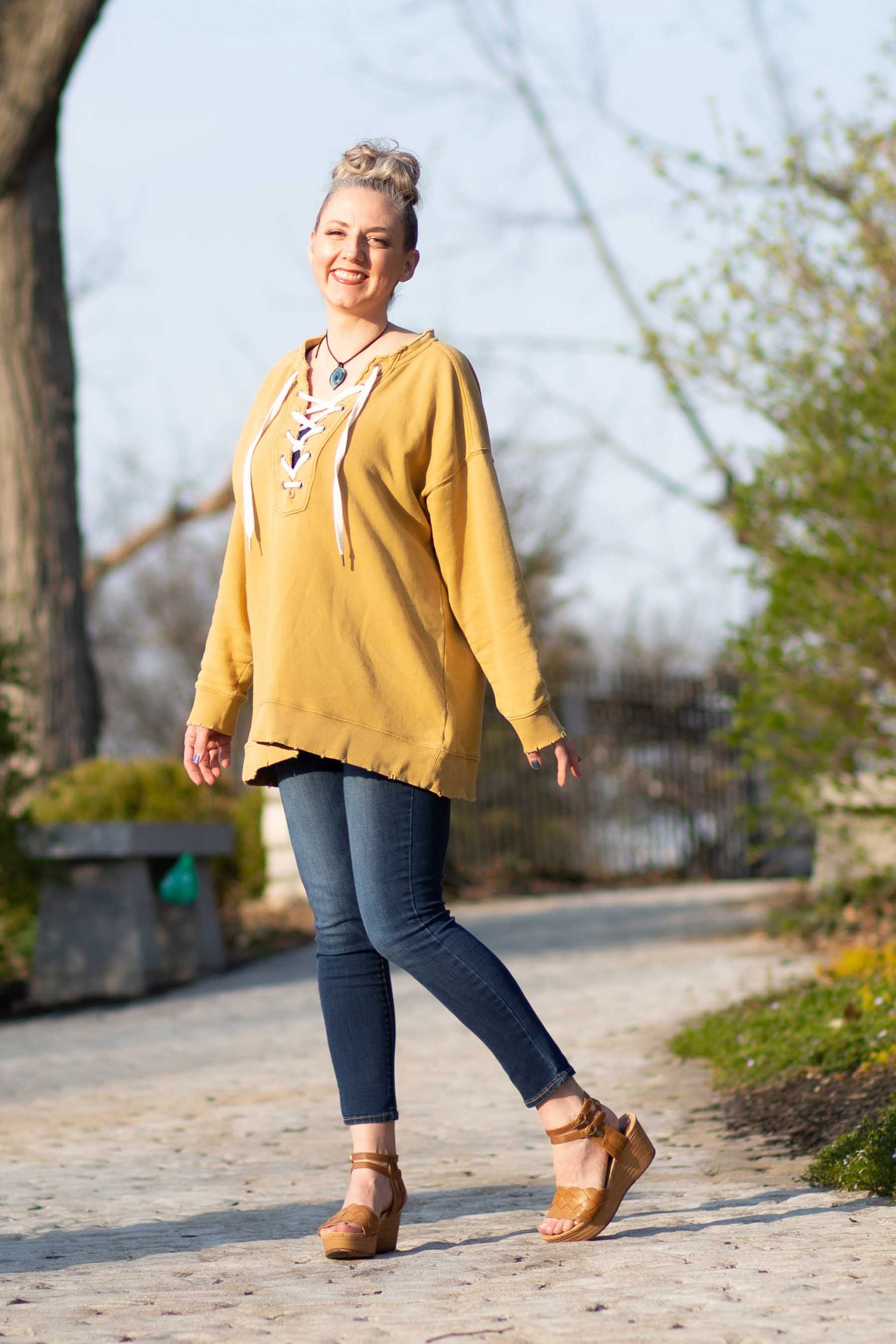 Lisa standing on a stone path