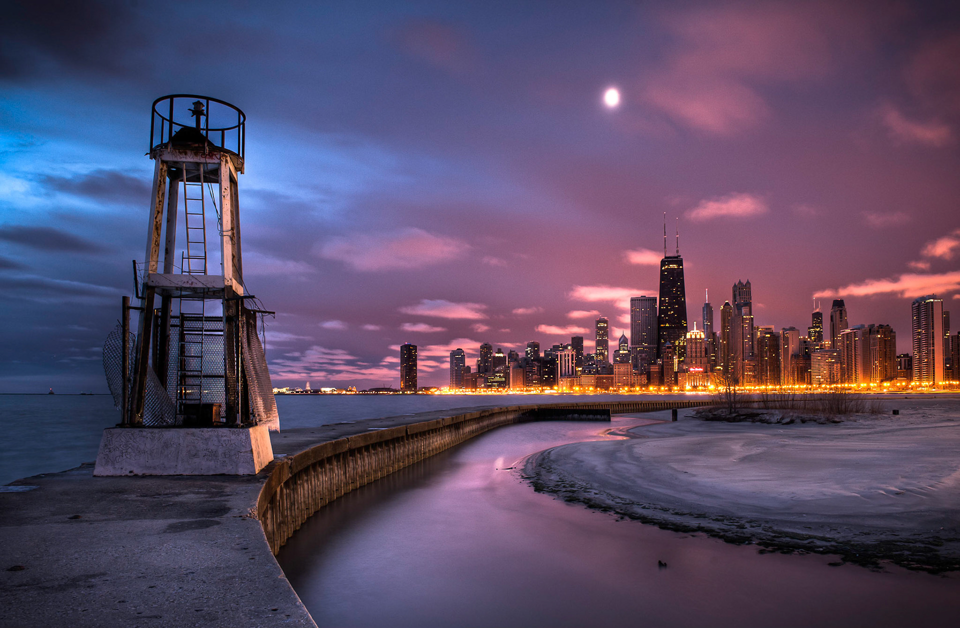 The Chicago skyline seen at sunrise from North Avenue Beach Pier.